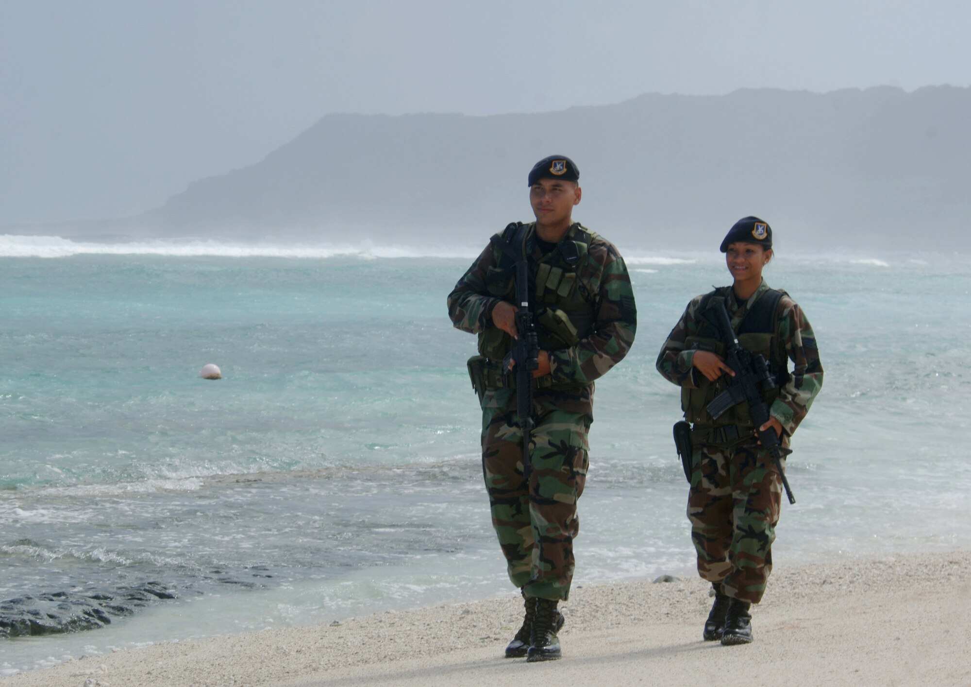 ANDERSEN AIR FORCE BASE, Guam (AFPN) -- Senior Airman Maria Ronquillo and Staff Sgt. Michael Quitugua patrol Tarague Beach here. Both Airmen are assigned to the Guam Air National Guard's 254th Security Forces Squadron.  (U.S. Air Force photo by Master Sgt. Val Gempis)