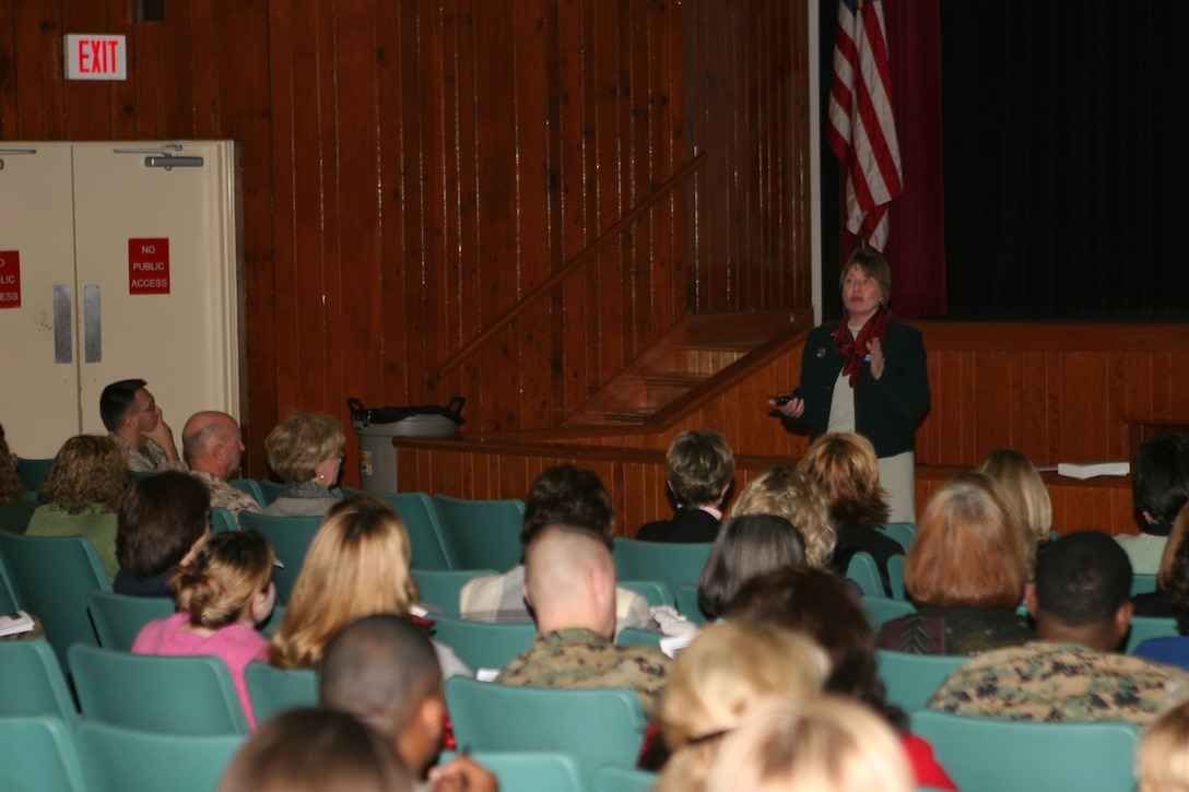 Joyce Wessel Raezer, director of government relations, National Military Family Association, addresses an audience at the Base Theater Jan. 18th. Raezer toured the base to look at the quality of life and to do a follow up on the privatization of base housing.