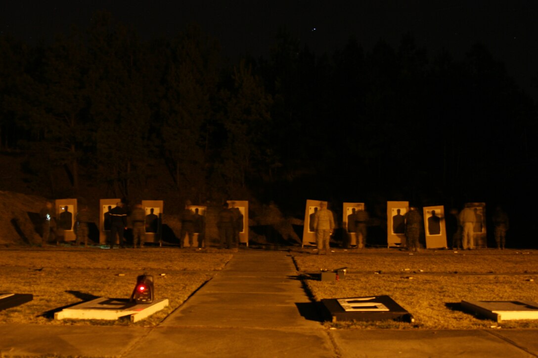 The Marines of the Headquarters and Headquarters Squadron Provost Marshal?s Office conduct annual low-light weapons training at the Station pistol range, Feb. 28.
