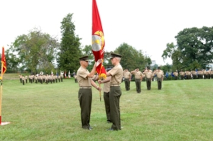 Brig. Gen. Michael Brogan (right) accepts the Marine Corps colors from Col. Steven Elkins at Marine Corps Systems Command?s Assumption of Command ceremony held in front of MARCORSYSCOM?s headquarters on Hospital Point in Quantico, Va. on Friday, Sept. 22nd.