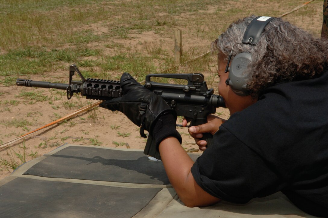 Lisa Reeves, the director for Student Leadership and Development at Central State University, fires the M4 during the 4th Marine Corps Recruiting District Educator?s Workshop.  She found shooting the weapons scary but fun.  The educators were given the opportunity to shoot rifles and pistols during the workshop.