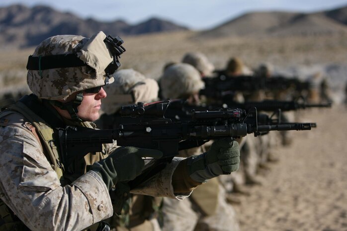 Lt. Michael J. Donaldson, assistant team leader for Border Transistion Team 13 faces towards a target and gets prepared to engance, Donaldson is one of many Marines participating in the Enhanced Marksmanship Program. BTT 13 is training with 3rd Battalion, 8th Marine Regiment. Both are conducting the Mojave Viper Exercise at Twentynine Palms Calif. the unit will deploy in support of Operation Iraqi Freedom in March.
