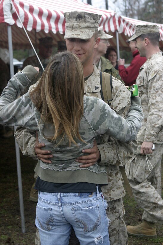 MARINE CORPS BASE CAMP LEJEUNE, N.C. - A Marine with Regimental Combat Team-2, 2nd Marine Division reunites with a loved one during the unit's homecoming reception here Feb. 23.  The Marines and sailors had been conducting counterinsurgency operations in far western Iraq since March 2005, where they helped liberate 10 cities, establish a permanent Iraqi Security Force presence and kill more than 800 insurgents.