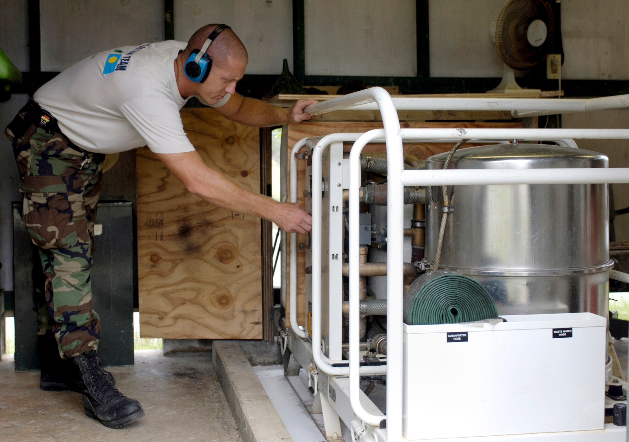 BABLEDAOB, Palau (AFPN) -- Tech. Sgt. Mike Luhmann starts a pump to begin the process of making water for Camp Katuu. Sergeant Lahmann is a plumber with the civic action team here. (U.S. Air Force photo by Tech. Sgt. Shane A Cuomo)