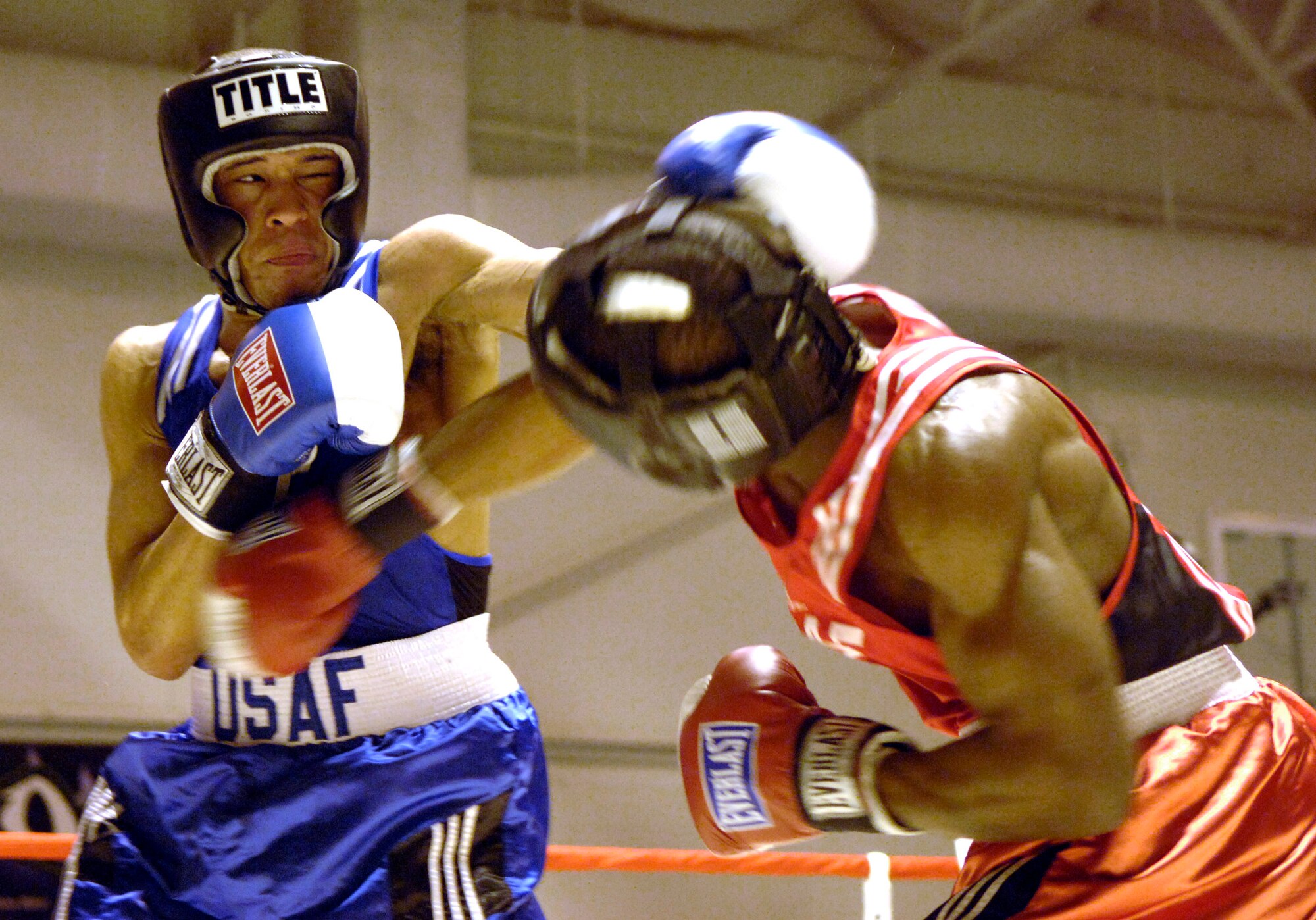 SAN ANTONIO -- Andre Penn connects with a left hook while Gary Griffin connects with a body shot during a match, Jan. 20. Penn is from Ellsworth Air Force Base, S.D., and Griffin is from Stewart Air National Guard Base, N.Y. Both will represent the Air Force at the Armed Forces Boxing Tournament, Feb. 6 - 11. (U.S. Air Force photo by Tech. Sgt. Larry A. Simmons)