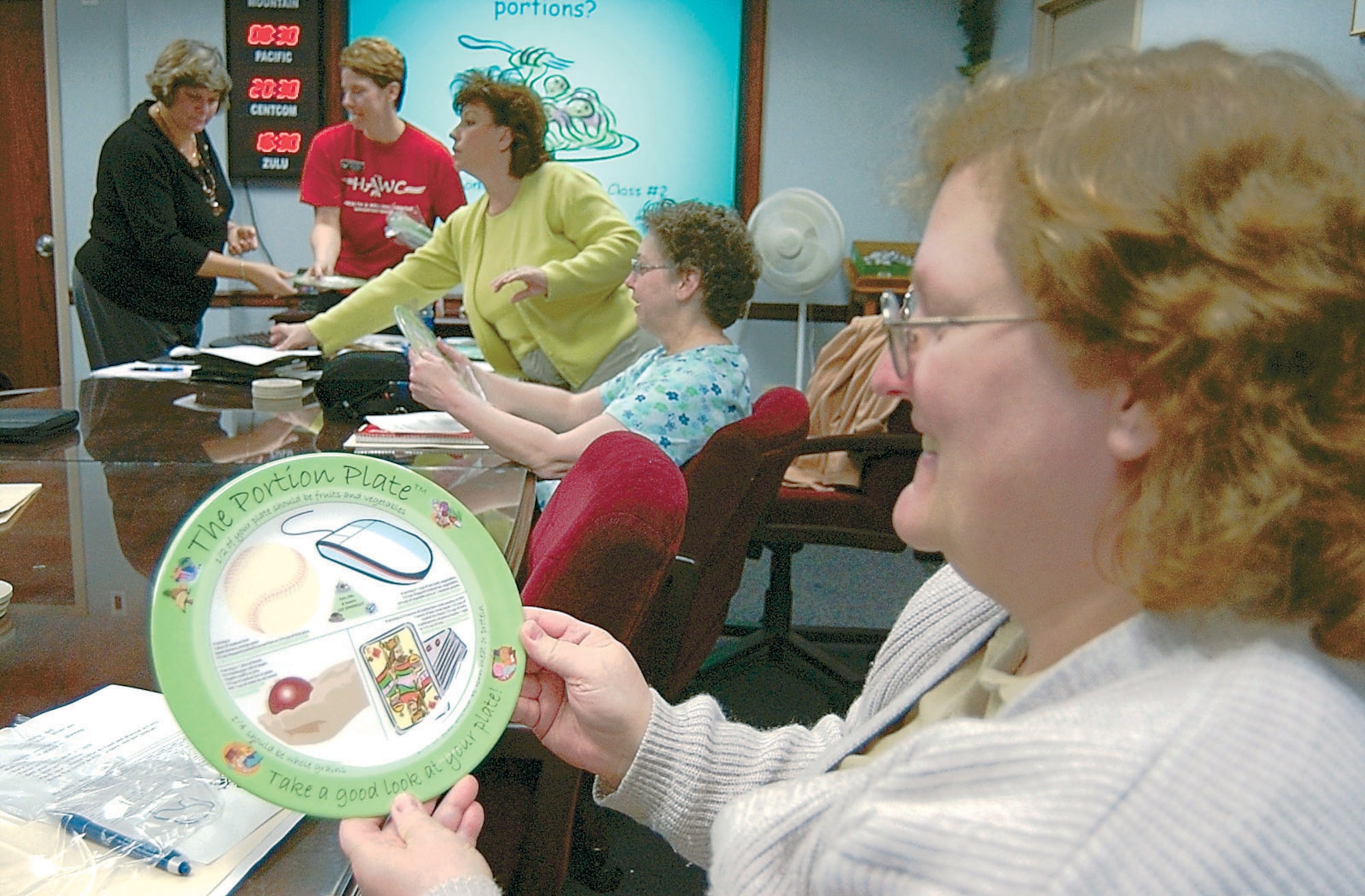 WRIGHT-PATTERSON AIR FORCE BASE, Ohio (AFPN) -- Terry Bohannon holds a "portion plate" during the weight-reduction class, Portion off the Pounds, here Jan. 17. (U.S. Air Force photo)