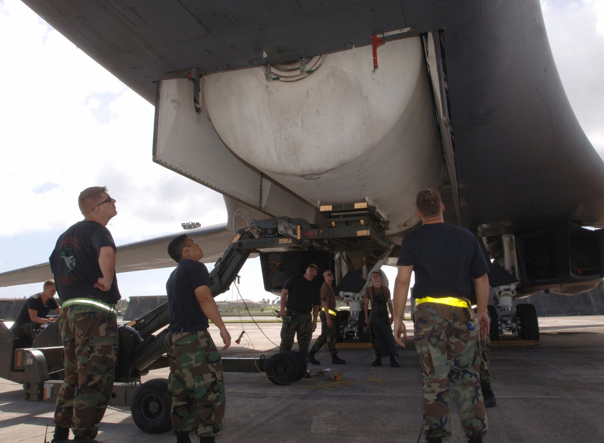 ANDERSEN AIR FORCE BASE, Guam (AFPN) -- Mechanics lower the weapons bay fuel tank of a B-1B Lancer during an inspection here. The Airmen, members of the 28th Aircraft Maintenance Squadron at Ellsworth Air Force Base, S.D., are here for an air and space expeditionary deployment. (U.S. Air Force photo by Master Sgt. Val Gempis)