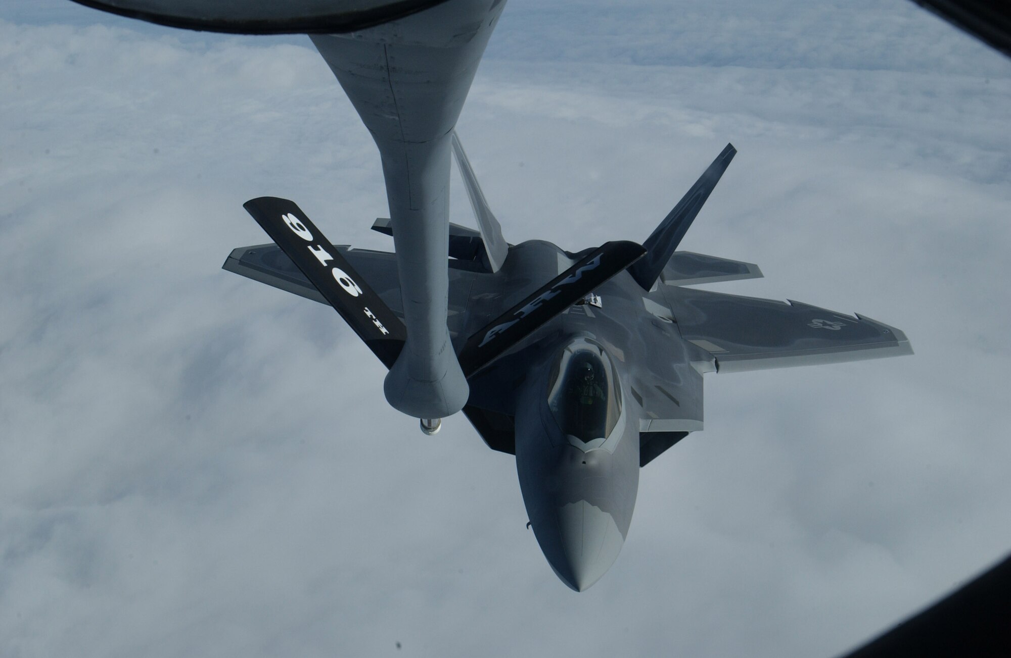 An F-22A Raptor from Langley Air Force Base, Va. prepares to receive a load of fuel from a 916th Air Refueling Wing KC-135R Stratotanker Saturday. This refueling mission was part of the Raptor's first operational mission.  (U.S. Air Force photo by Airman Shane Dunaway)