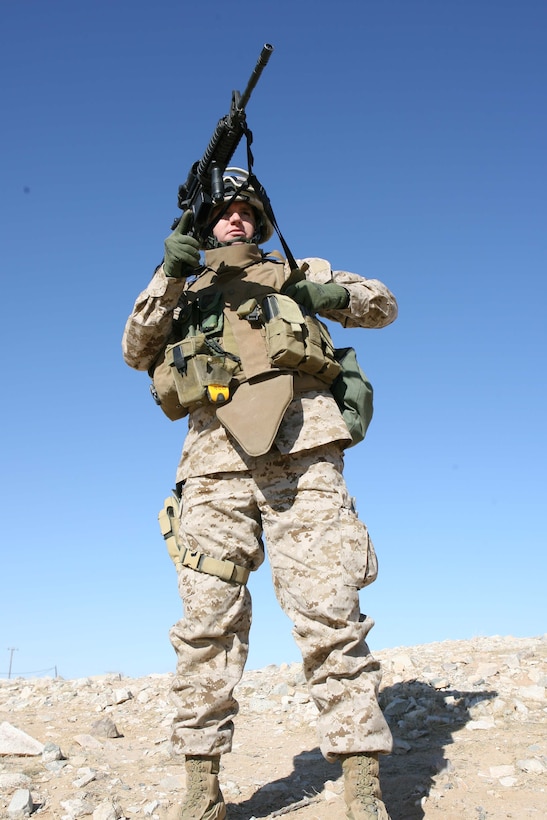 Maj. William F. Wahle, Military Transistion Team leader for 3rd Battalion, 8th Marine Regiment quickly reloads his rifle during an Enhanced Marksmanship Training simulation held on range 104 at Marine Corps Air Ground Comabat Cenert Twentynine Palms. The goal of the MTT is to train and mentor the Iraqi Security Forces.