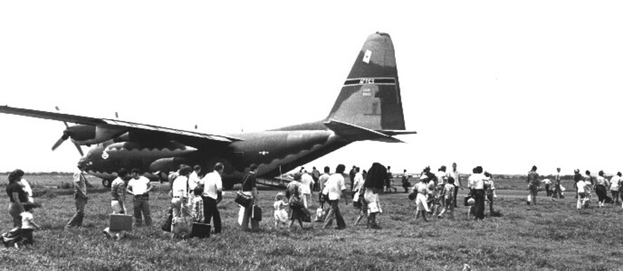 Evacuees load into a 442nd Military Airlift Wing C-130 Hercules after flooding in the Southeast United States.