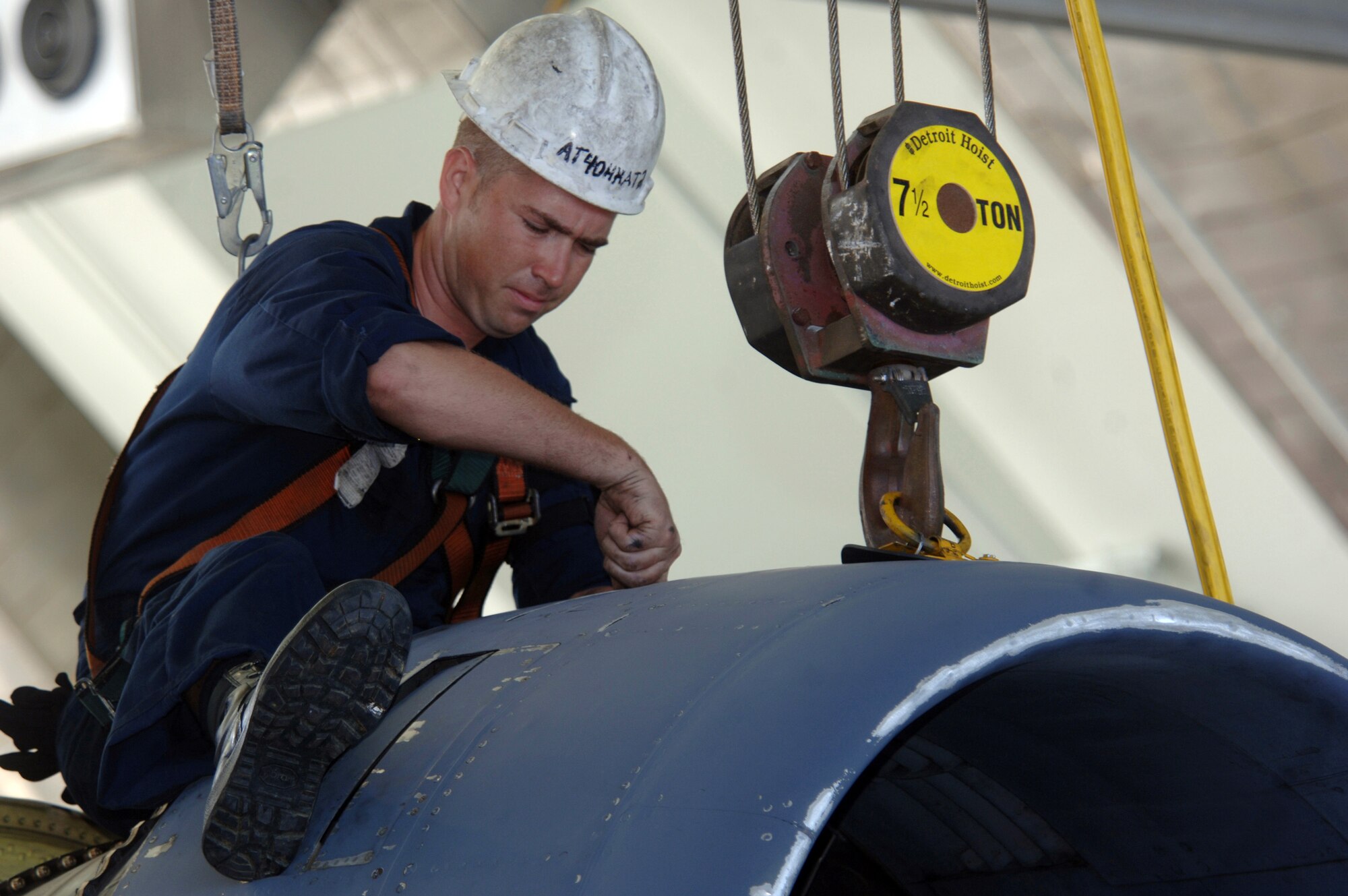 ANDERSEN AIR FORCE BASE, Guam (AFPN) -- Senior Airman Tommy Taylor inspects the engine of his B-52 Stratofortress aircraft during phase maintenance at Hangar 1 here.  Airman Taylor is deployed from the 2nd Maintenance Squadron based at Barksdale Air Force Base, La. The B-52s come here from a forward-deployed location and go into phase maintenance after 300 flying hours. The $34-million hangar is the newest in the Air Force and can house any type of Air Force aircraft. (U.S. Air Force photo by Master Sgt. Val Gempis)