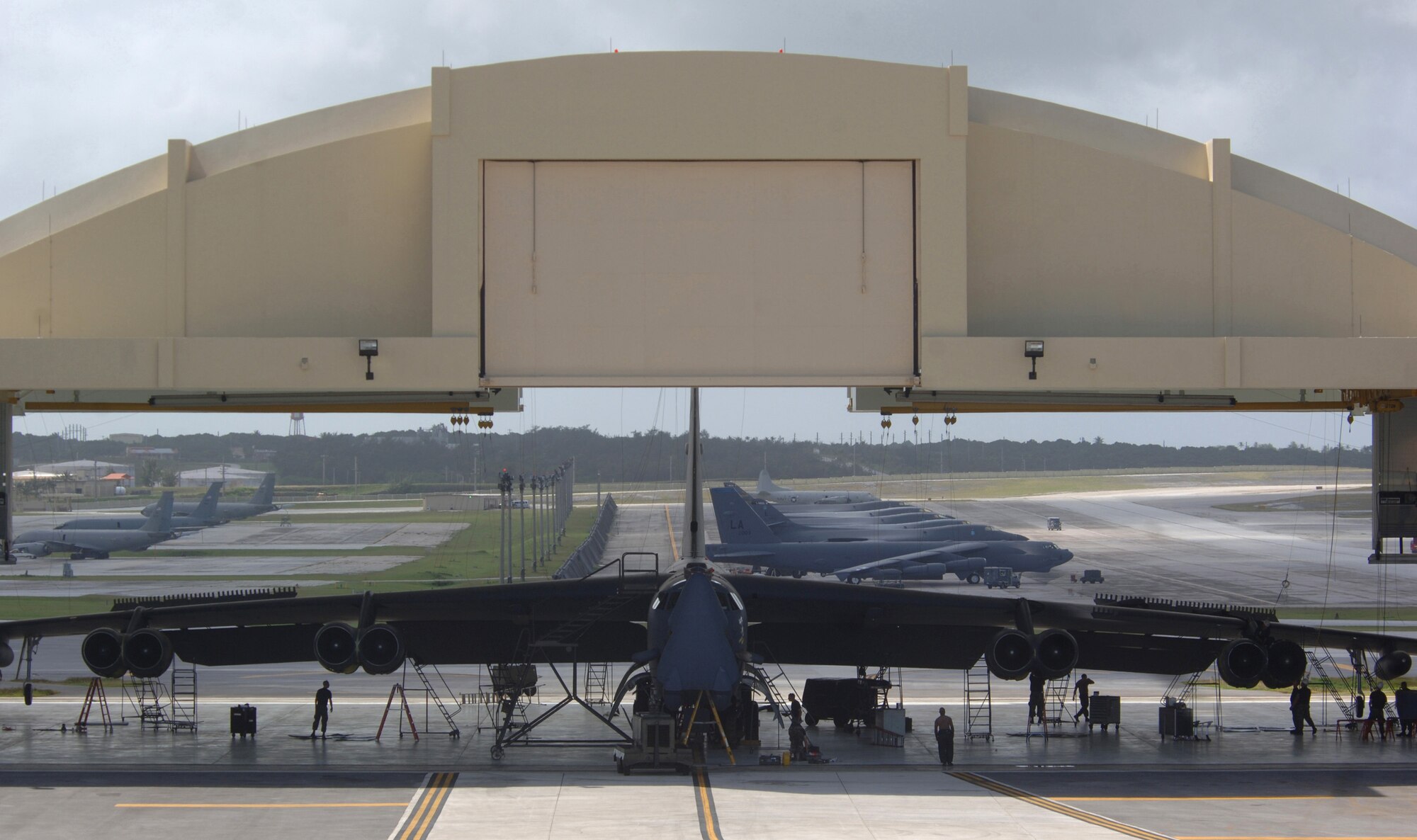 ANDERSEN AIR FORCE BASE, Guam (AFPN) -- B-52 Stratofortress mechanics inspect their aircraft during phase maintenance at Hangar 1 here. The Airmen are members of the 2nd Maintenance Squadron based at Barksdale Air Force Base, La. The B-52s come here from a forward-deployed location and go into phase maintenance after 300 flying hours. The $34-million hangar is the newest in the Air Force and can house any type of Air Force aircraft. (U.S. Air Force photo by Master Sgt. Val Gempis)