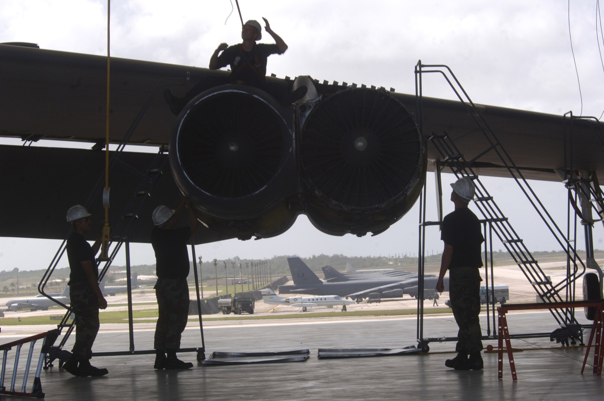 ANDERSEN AIR FORCE BASE, Guam -- B-52 Stratofortress mechanics inspect an aircraft engine during phase maintenance. The Airmen are deployed from the 2nd Maintenance Squadron at Barksdale Air Force Base, La. (U.S. Air Force photo by Master Sgt. Val Gempis)

