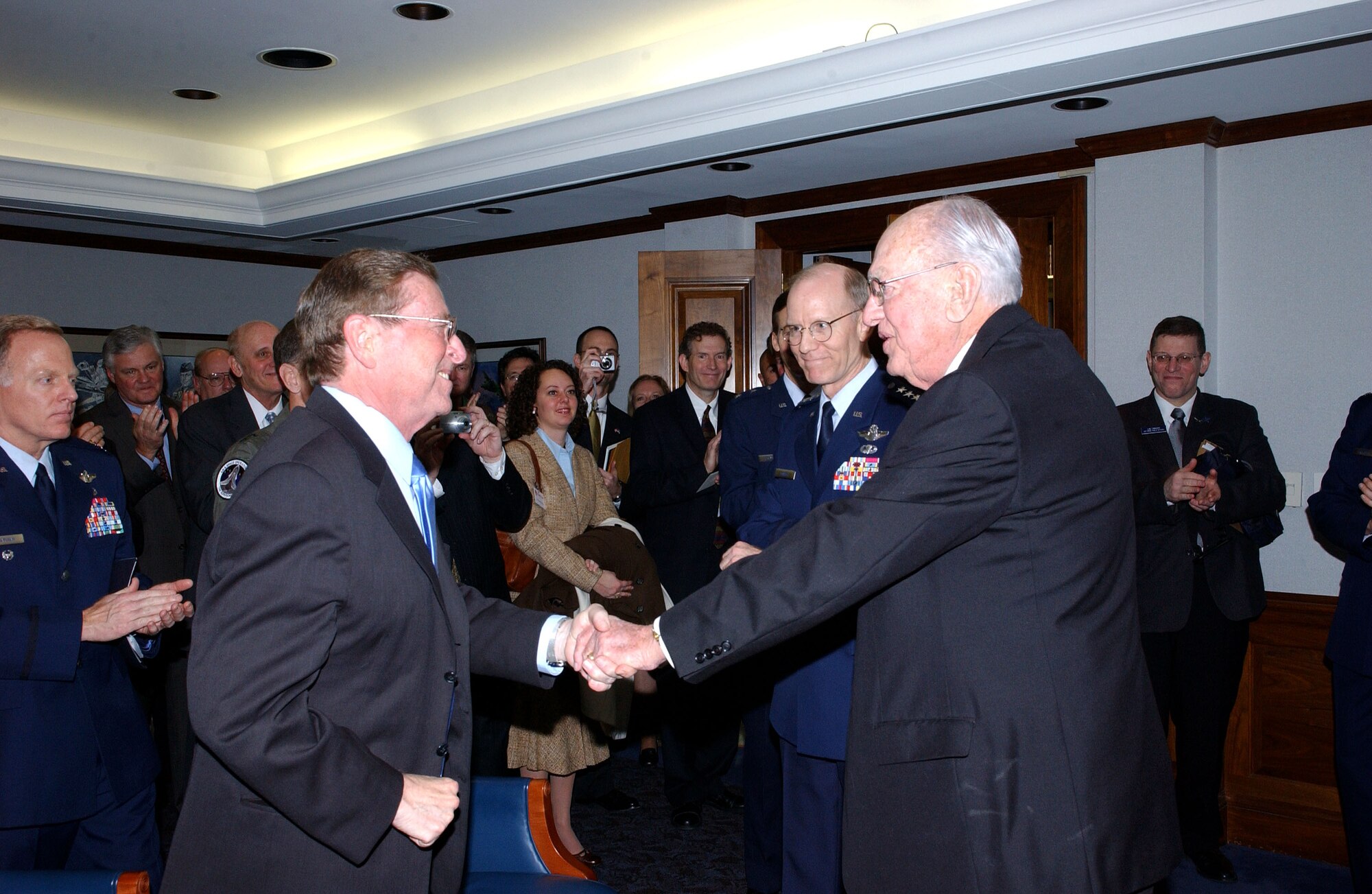 PENTAGON (AFPN) -- New Mexico Sen. Pete Domenici (left) congratulates Ernest O. Stewart Jan. 23. Mr. Stewart is the Air Force's nomination for the Zachary and Elizabeth Fisher Distinguished Civilian Humanitarian Award. Mr. Stewart is an active civic leader for Cannon Air Force Base, N.M., and has supported the Air Force for more than 50 years. Established in 1996, the award honors an individual or organization demonstrating exceptional patriotism and humanitarian concern for members of the U.S. armed forces or their families. Each service branch annually submits nominees. The Fisher House Foundation annually supports more than 8,500 military families of unexpected illness, disease or injury. (U.S. Air Force photo by Ron Hall)