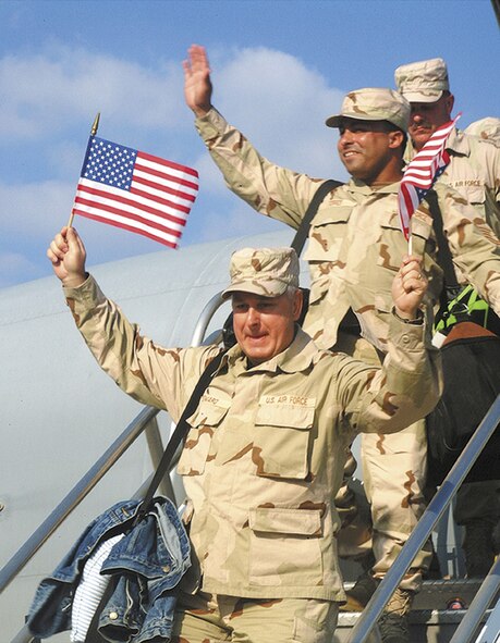 442nd Fighter Wing members wave to family and friends upon their return from Operation Enduring Freedom to Whiteman Air Force Base, Mo.  The 442nd FW is an Air Force Reserve unit. (Photo by Master Sgt. Bill Huntington)