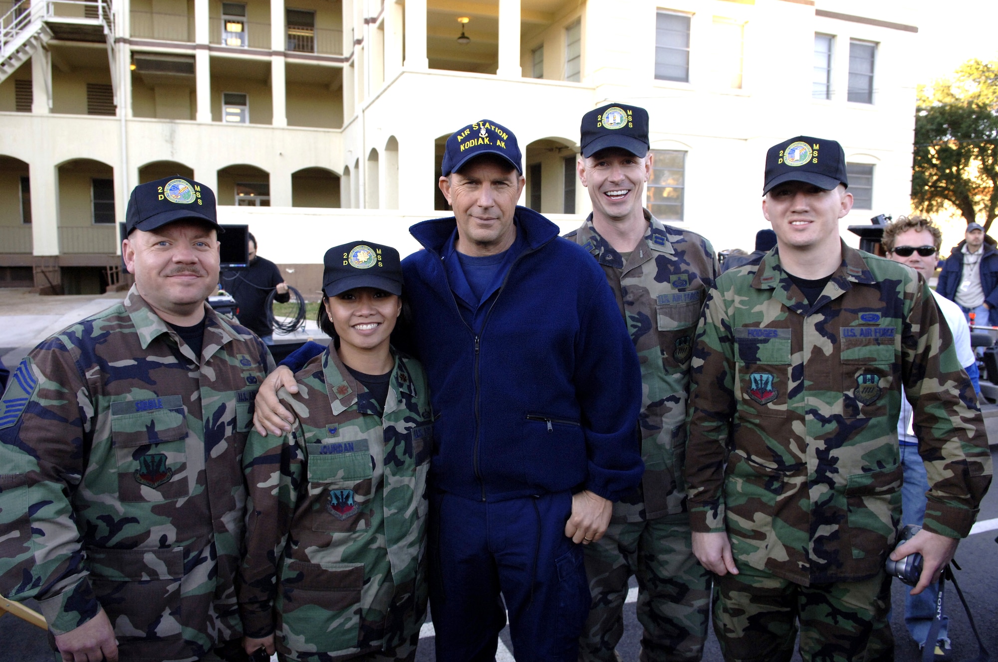 BARKSDALE AIR FORCE BASE, La. (AFPN) -- Kevin Costner poses with Maj. Rose Jourdan, commander of the 2nd Mission Support Squadron, and her staff during a break in filming the movie "The Guardian." Parts of the movie were filmed on base Jan. 12 and 13.  (U.S. Air Force photo by Master Sgt. Michael Kaplan) 