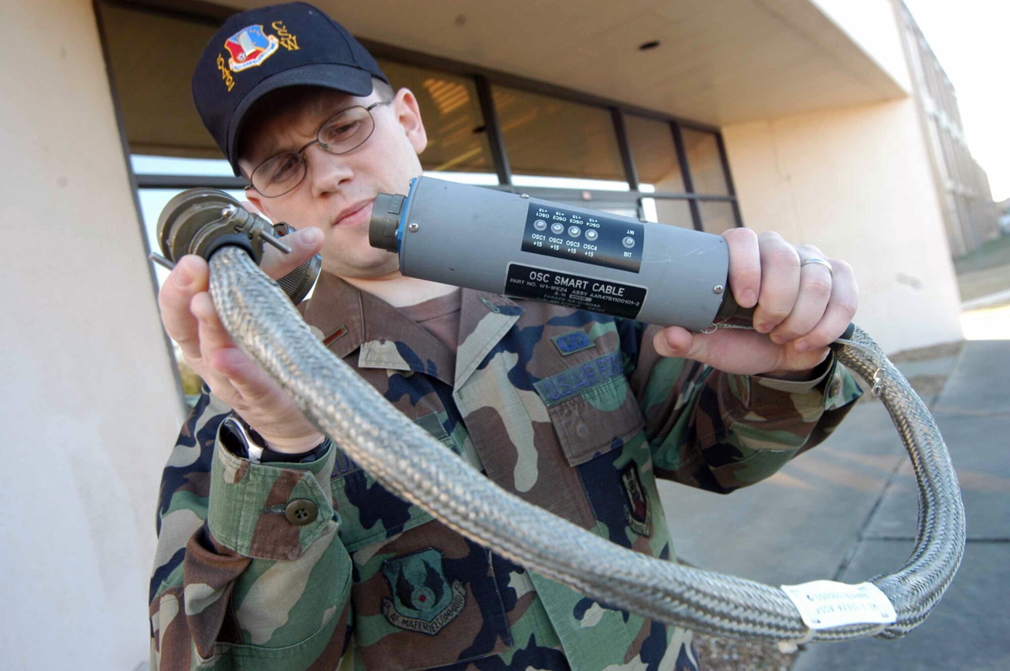 ROBINS AIR FORCE BASE, Ga. -- Second Lt. Chris Lundell holds a Smart Cable. He is an AAR-47 engineer. (U.S. Air Force photo by Sue Sapp) 


