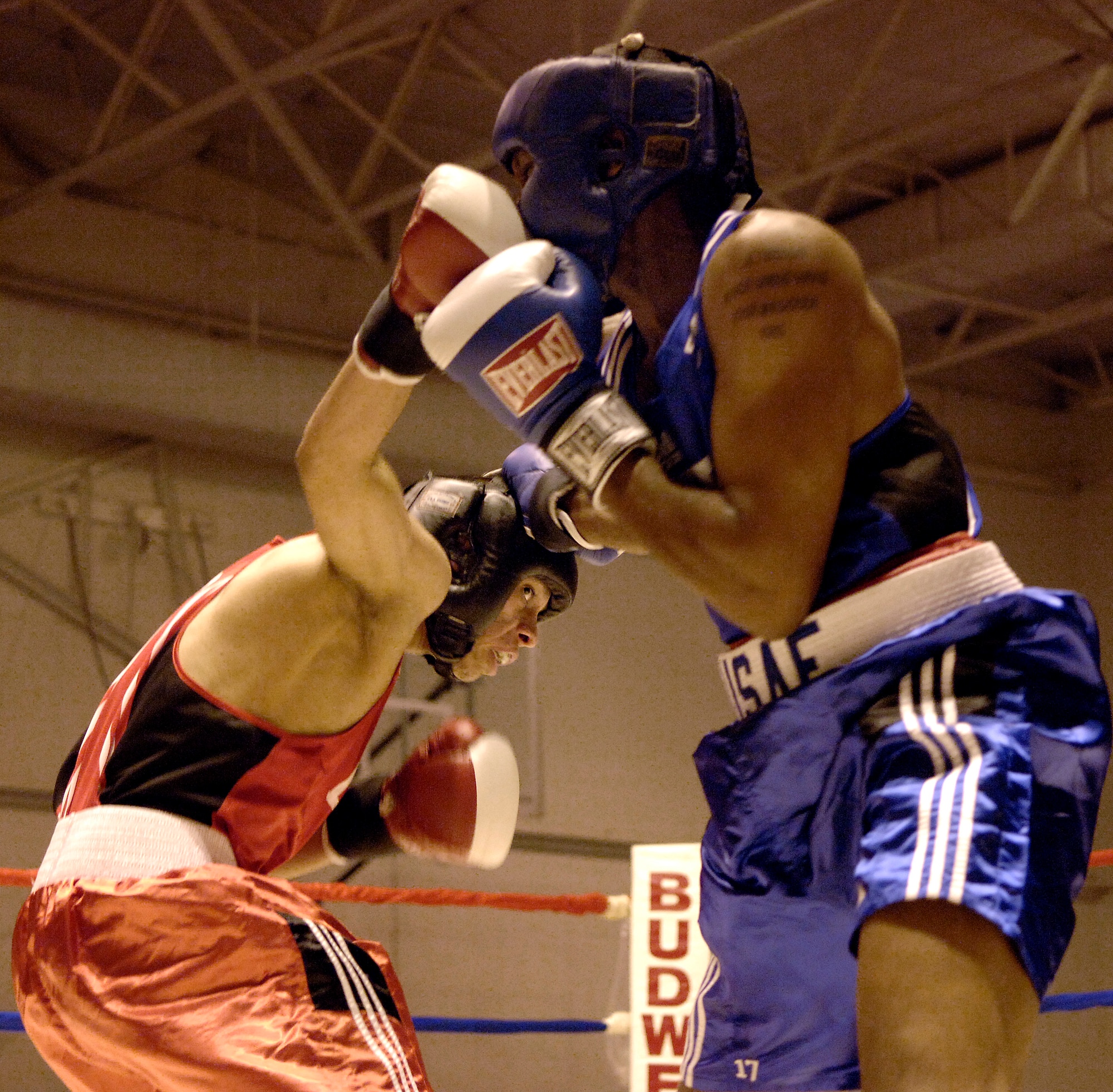 SAN ANTONIO (AFPN) -- Hector Ramos connects with an over-the-top hook to Kevin Leggett in the second round of their match Jan. 20. Ramos is from Travis Air Force Base, Calif., and Leggett is from Homestead Air Reserve Base, Fla. Ramos will represent the Air Force at the Armed Forces Boxing Tournament at Fort Huachuca, Ariz., Feb. 6 to 11. (U.S. Air Force photo by Tech. Sgt. Larry A. Simmons)