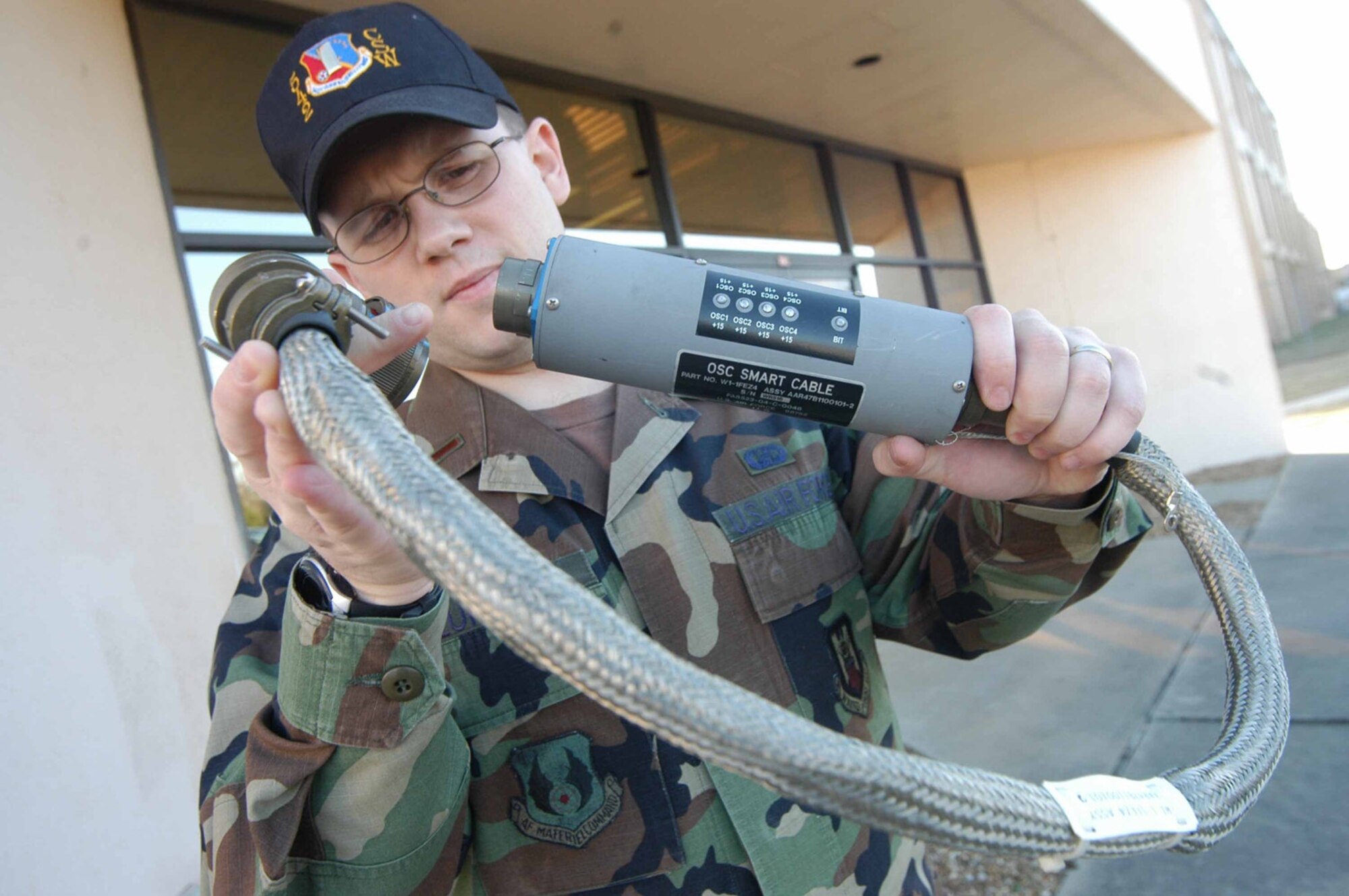 Second Lt. Chris Lundell, AAR-47 engineer, holds a Smart Cable.  (Air Force photo by Sue Sapp)