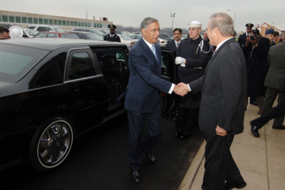 Secretary of Defense Donald H. Rumsfeld (right) greets Pakistani Prime Minister Shaukat Aziz as he arrives at the Pentagon in Arlington, Va., on Jan. 23, 2006. Rumsfeld, Aziz and their senior advisors will meet to discuss mutual security interests. 
