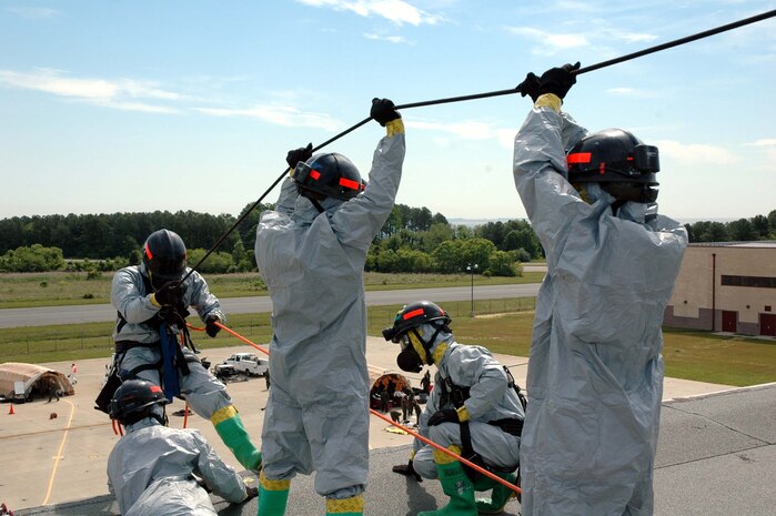 PATUXENT RIVER NAS--Technical Rescue personnel with the Chemical Biological Incident Response Force (CBIRF) secure a line as they prepare to rescue a victim that is trapped more than 40 feet off the ground during a training evolution May 24.  The exercise challenged the personnel to execute their mission with the additional strain of the summer heat, thereby strengthening the idea that top physical conditioning is paramount.