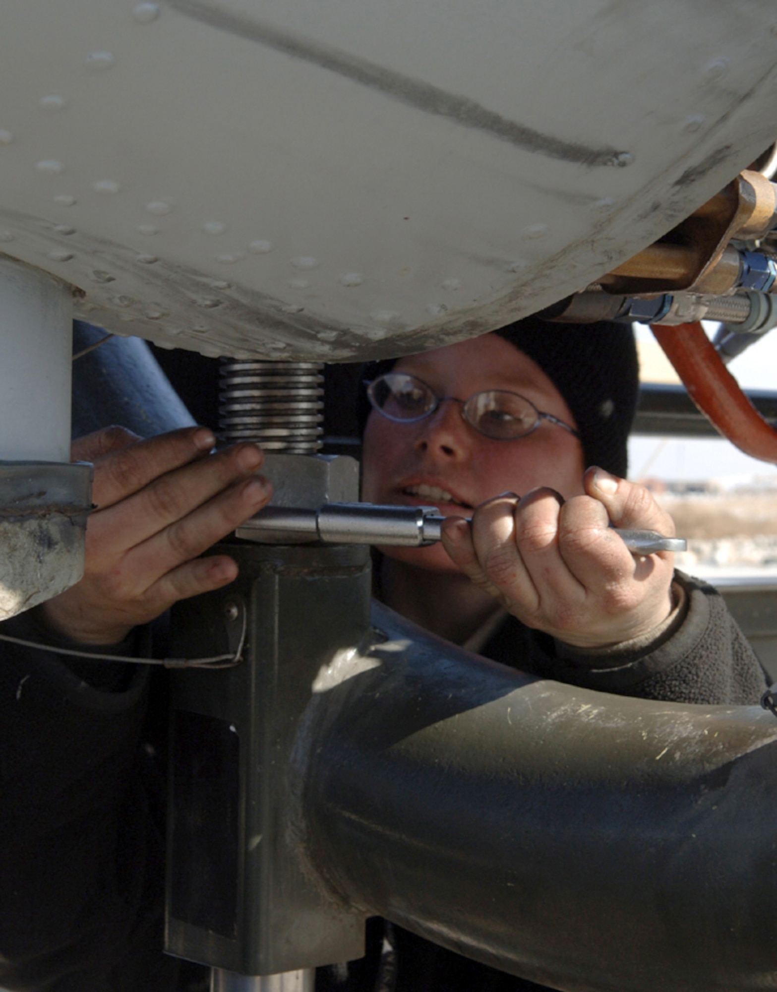 BAGRAM AIR BASE, Afghanistan (AFPN) -- Staff Sgt. Julie Jewett makes adjustments with a wrench while preparing to replace an engine from an A-10 Thunderbolt II. Sergeant Jewett is an aerospace propulsion craftsman with the 455th Expeditionary Aircraft Maintenance Squadron. (U.S. Air Force photo by Staff Sgt. Jennifer L. Redente)