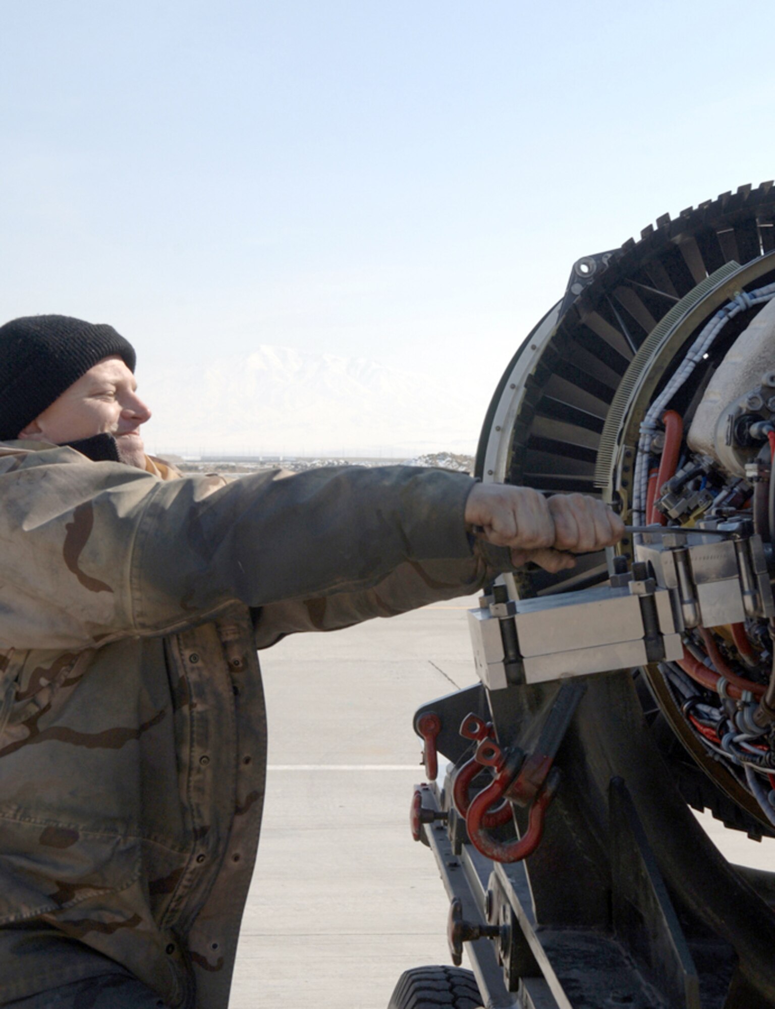 BAGRAM AIR BASE, Afghanistan (AFPN) -- Staff Sgt. Scott Sherman makes adjustments with a wrench while preparing to replace an engine from an A-10 Thunderbolt II.  Sergeant Sherman is an aerospace propulsion craftsman assigned to the 455th Expeditionary Aircraft Maintenance Squadron. (U.S. Air Force photo by Staff Sgt. Jennifer L. Redente)
