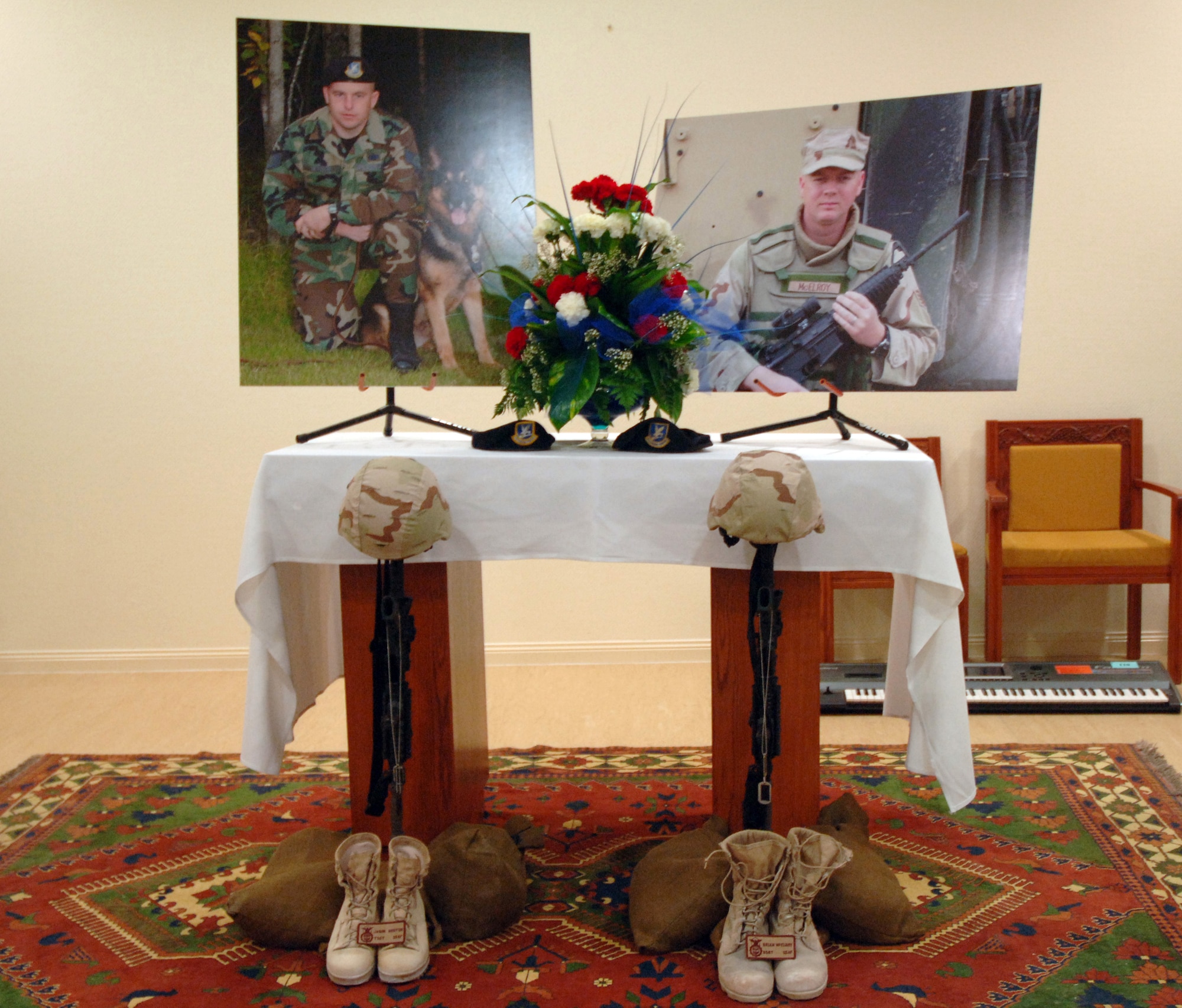 SOUTHWEST ASIA (AFPN) -- A tribute stands as a final salute during a memorial service at a deployed location here Jan. 26 to honor two fallen security forces Airmen from Elmendorf Air Force Base, Alaska.  Tech. Sgt. Jason L. Norton and Staff Sgt. Brian McElroy were assigned to the 379th Expeditionary Security Forces Squadron. (U.S. Air Force photo by Staff Sgt. Joshua Strang)


