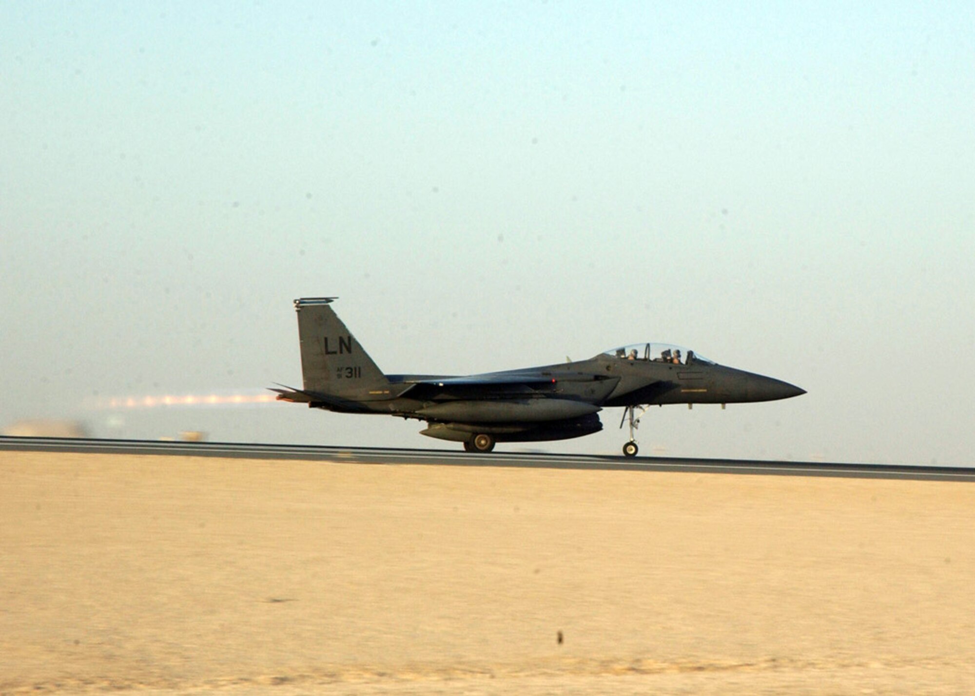 SOUTHWEST ASIA (AFPN) -- The first of many F-15E Strike Eagles deployed from Royal Air Force Lakenheath, England, takes off Jan. 25 and returns to its home station after serving at a deployed location. The Strike Eagles were assigned to the 492nd Expeditionary Fighter Squadron here.  (U.S. Air Force photo by Airman 1st Class Anthony Nelson Jr.)