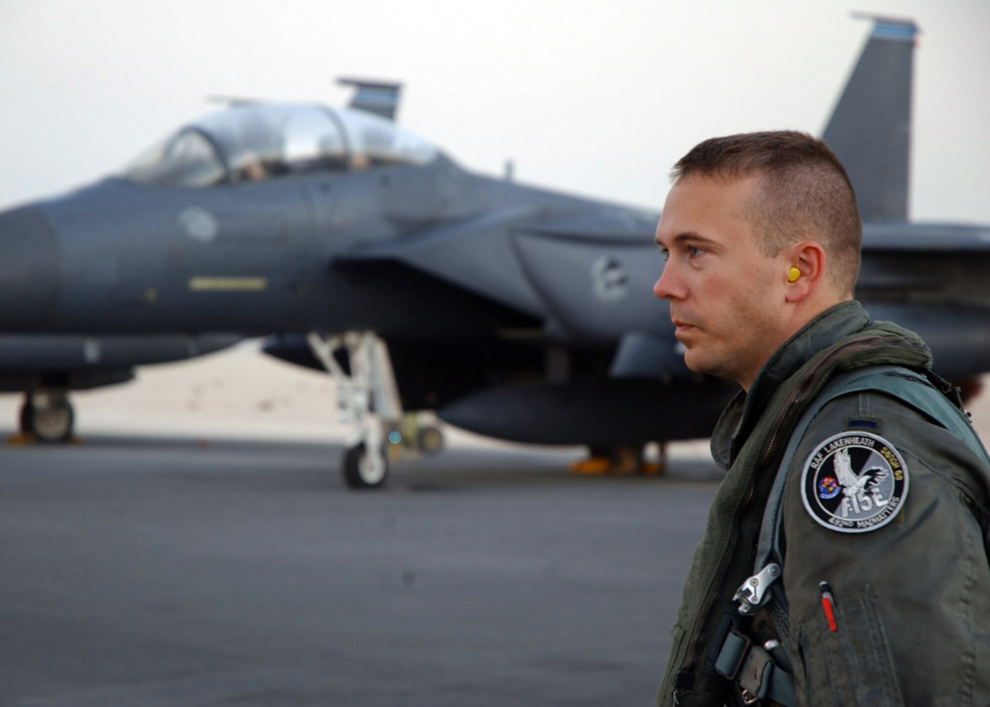 SOUTHWEST ASIA (AFPN) -- First Lt. Brian Robbins looks off to the distance as he reflects on his time spent at a deployed location.  Lieutenant Robbins is a pilot assigned to the 492nd Expeditionary Fighter Squadron. The unit returned to its home station at Royal Air Force Lakenheath, England, Jan. 25. (U.S. Air Force photo by Airman 1st Class Anthony Nelson Jr.)


