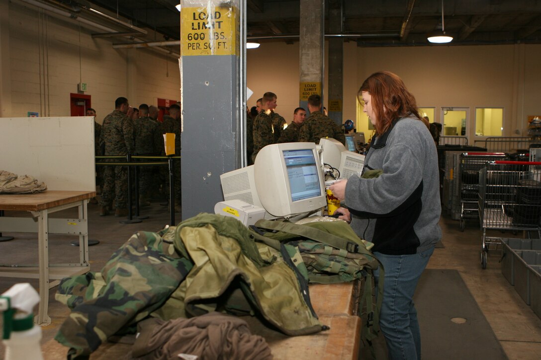 Boy scouts from Troop 196 and 45 observe a CH-46 Sea Knight, which belongs to HMM-774 in Naval Station Norfolk Va. on February 26, 2006. HMM-774 is also providing their hanger to the 24th Marine Expeditionary Unit for their Training in Urban Environment Exercise.