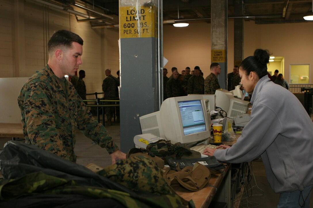 Boy scouts from Troop 196 and 45 observe a CH-46 Sea Knight, which belongs to HMM-774 in Naval Station Norfolk Va. on February 26, 2006. HMM-774 is also providing their hanger to the 24th Marine Expeditionary Unit for their Training in Urban Environment Exercise.