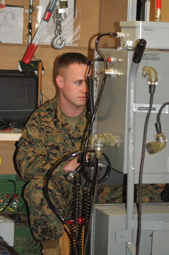 Sgt. John Fury, Explosive Ordnance Disposal technician Headquarters and Headquarters Squadron, views the monitor used to control the Remotec Andros robot, which EOD uses to investigate potentially threatening ordnance at the EOD building.