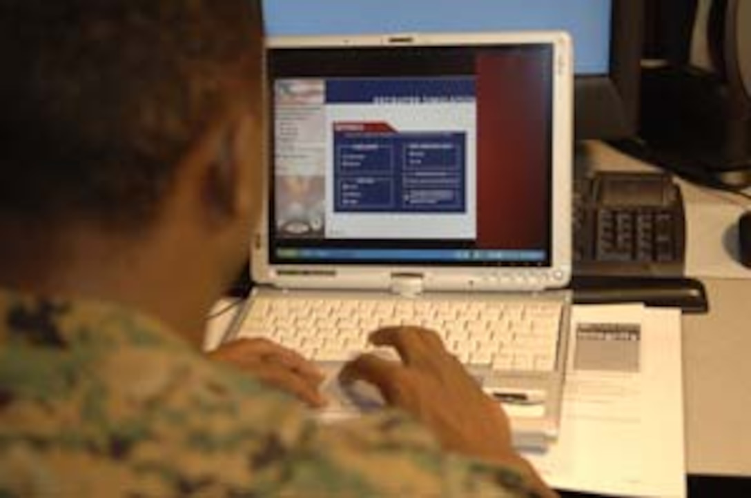 Staff Sgt. Maurice T. James, information assurance officer, Marine Corps Recruiting Command, works on a new Tablet PC computer. MCRC began shipping Tablet PC computers to recruiters in early September.  These Tablet PCs are designed to enhance systematic recruiting by speeding up the enlistment process of applicants.