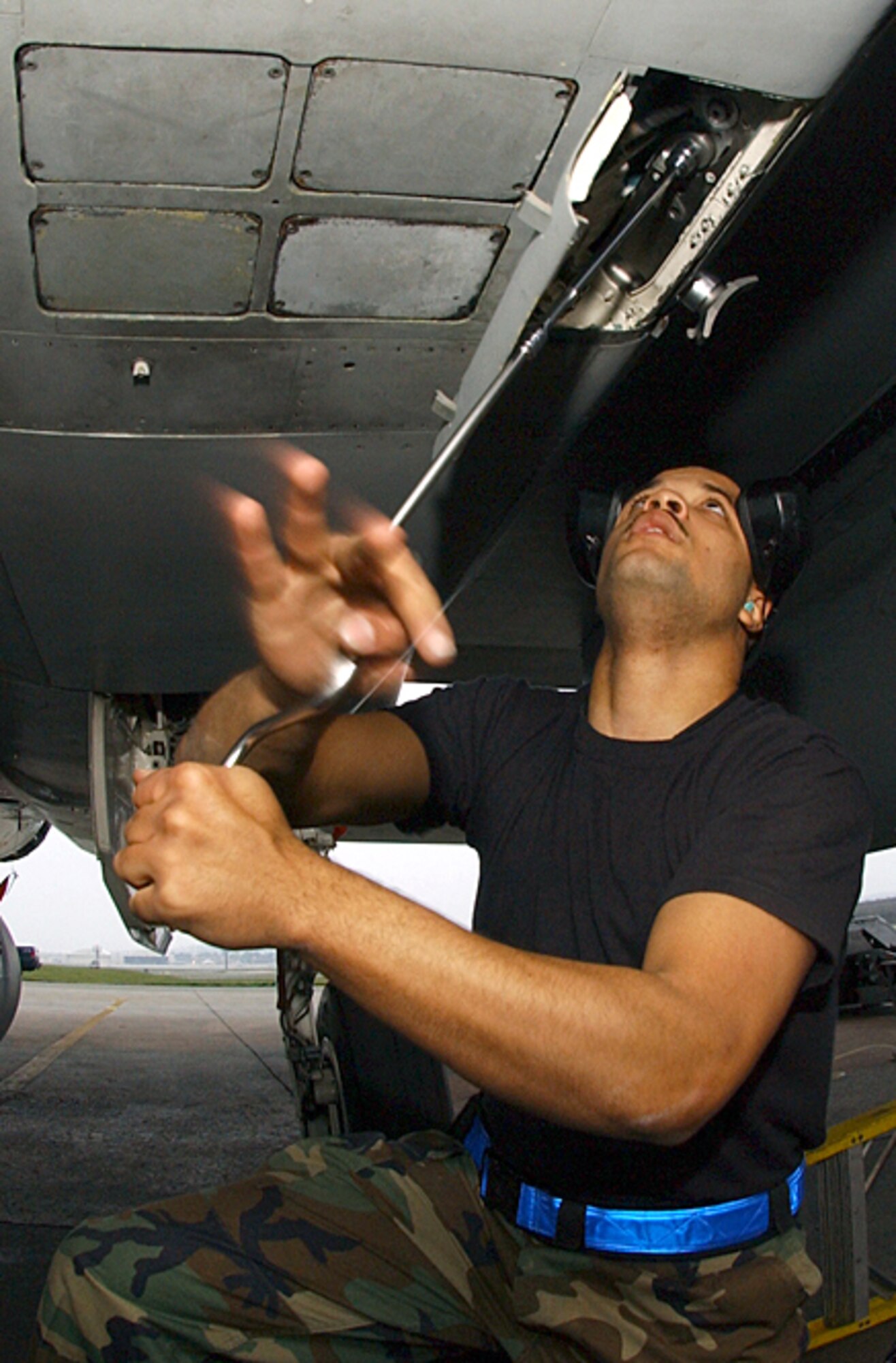 KADENA AIR BASE, Japan (AFPN) -- Senior Airman Jason Robinson makes preparations on an F-15C Eagle in order to load munitions Jan. 27. Airmen competed in a load crew competition Jan. 27. The load crew competition evaluates the Airmen's timeliness and accuracy of loading munitions. Airmen Robinson is a weapons load crew with the 44th Aircraft Maintenance Squadron. (U.S. Air Force photo by Airman 1st Class Stephanie Sinclair)