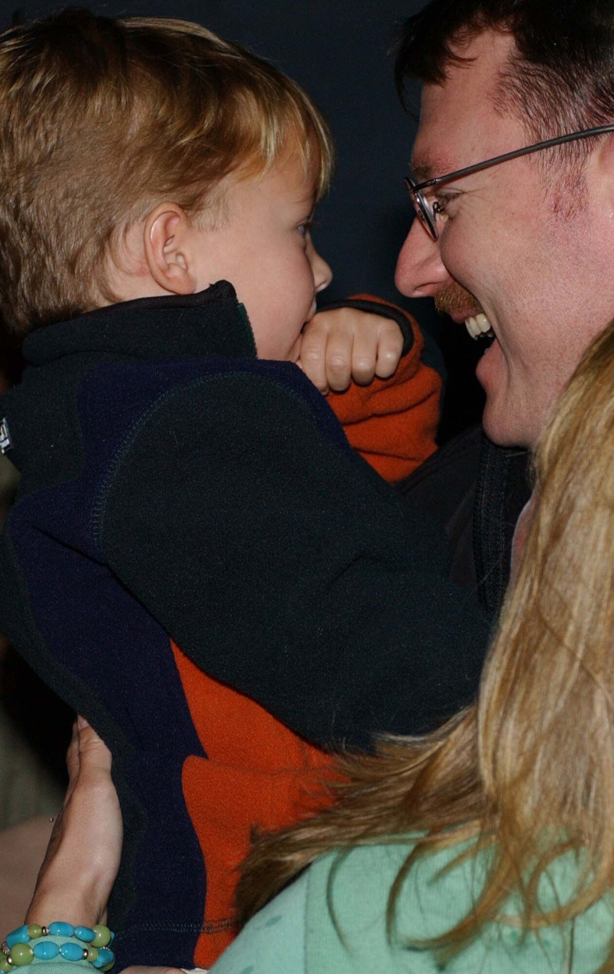Maj. Michael Pakiz, 15th Special Operations Squadron, hold s his son after returning home from a deployement Jan.17.
