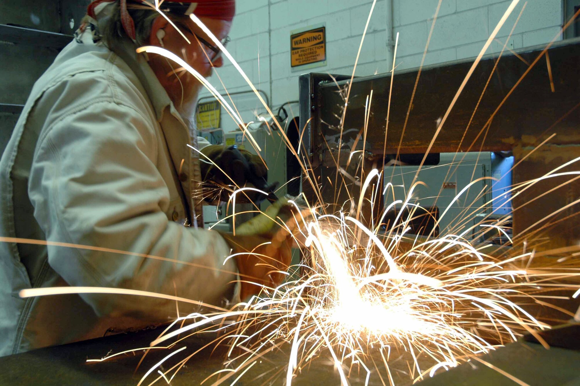 EGLIN AIR FORCE BASE, Fla. (AFPN) -- Danny Franklin grinds a piece of metal for an MK-84 container loading adapter designed by the munitions materiel handling equipment focal point. They support the Air Force armament and munitions community with the development of munitions support equipment, designing and fabricating tools to make life on the flightline easier for munitions Airmen. Mr. Franklin is with the 46th Test Wing Fabrication and Installation team. (U.S. Air Force photo by Senior Airman Mike Meares)