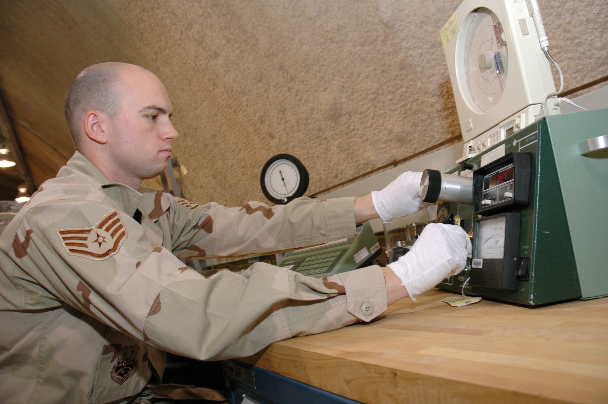 SOUTHWEST ASIA (AFPN) -- Staff Sgt. Kenneth Tottle calibrates a pressure gauge used to regulate aircraft tires. He is a precision measurement equipment laboratory technician with the 379th Expeditionary Maintenance Squadron. (U.S. Air Force photo by Master Sgt. Stanley Coleman)
