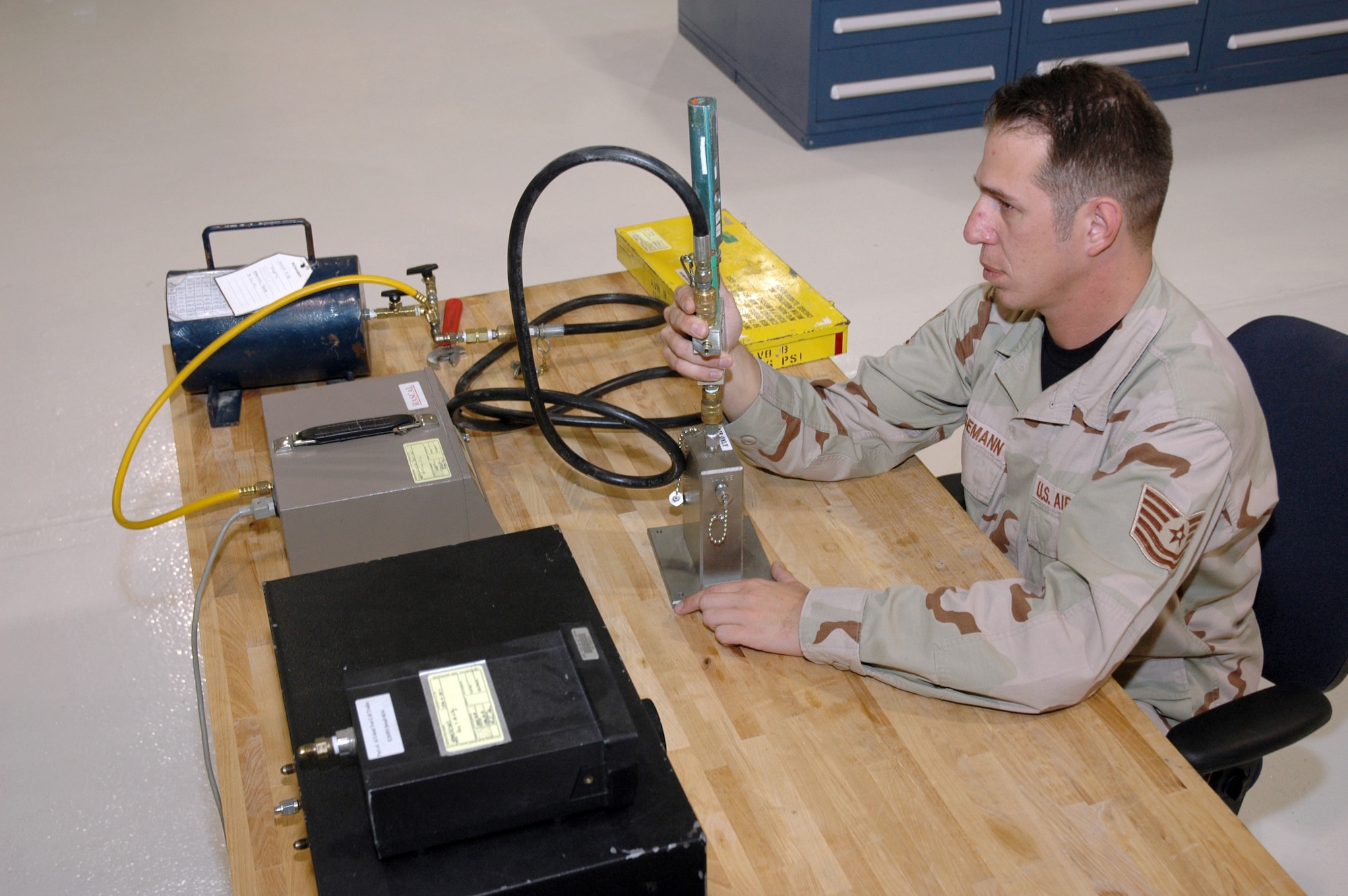 SOUTHWEST ASIA (AFPN) -- Tech. Sgt. Mike Krogemann performs a quality review evaluation of a tire inflator kit. He is a precision measurement equipment laboratory technician with the 379th Expeditionary Maintenance Squadron. (U.S. Air Force photo by Master Sgt. Stanley Coleman)
