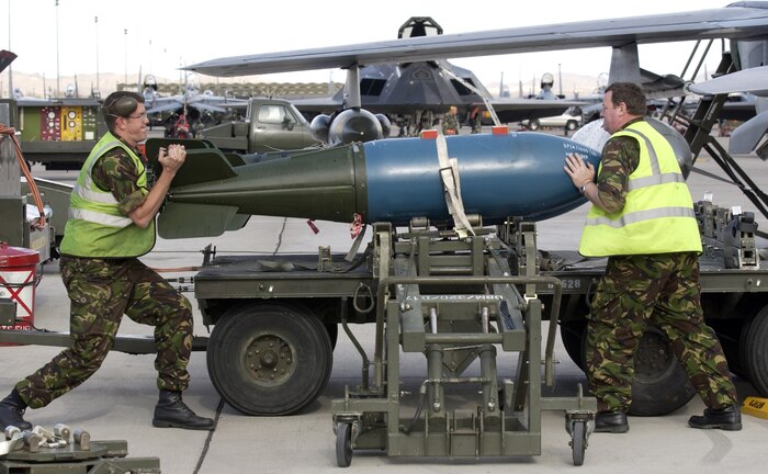 NELLIS AIR FORCE BASE, Nev. (AFPN) -- Royal Air Force Sgt. John Longstaff (left) and Senior Aircraftsman Philip Martin load an inert 1,000-pound bomb on a British Tornado jet Jan. 25 during Red Flag 06-1 here Jan. 21 to Feb. 18. Red Flag tests fliers' war-fighting skills in realistic combat situations. Flights involve more than 80 aircraft, including B-2 Spirit bombers and F-16 Fighting Falcons. The aircraft will fly missions day and night at the nearby Nevada Test and Training Range.  Along with the Air Force, units from the Army, Navy, Marine Corps, United Kingdom and Australia are participating. (U.S. Air Force photo by Master Sgt. Kevin J. Gruenwald)