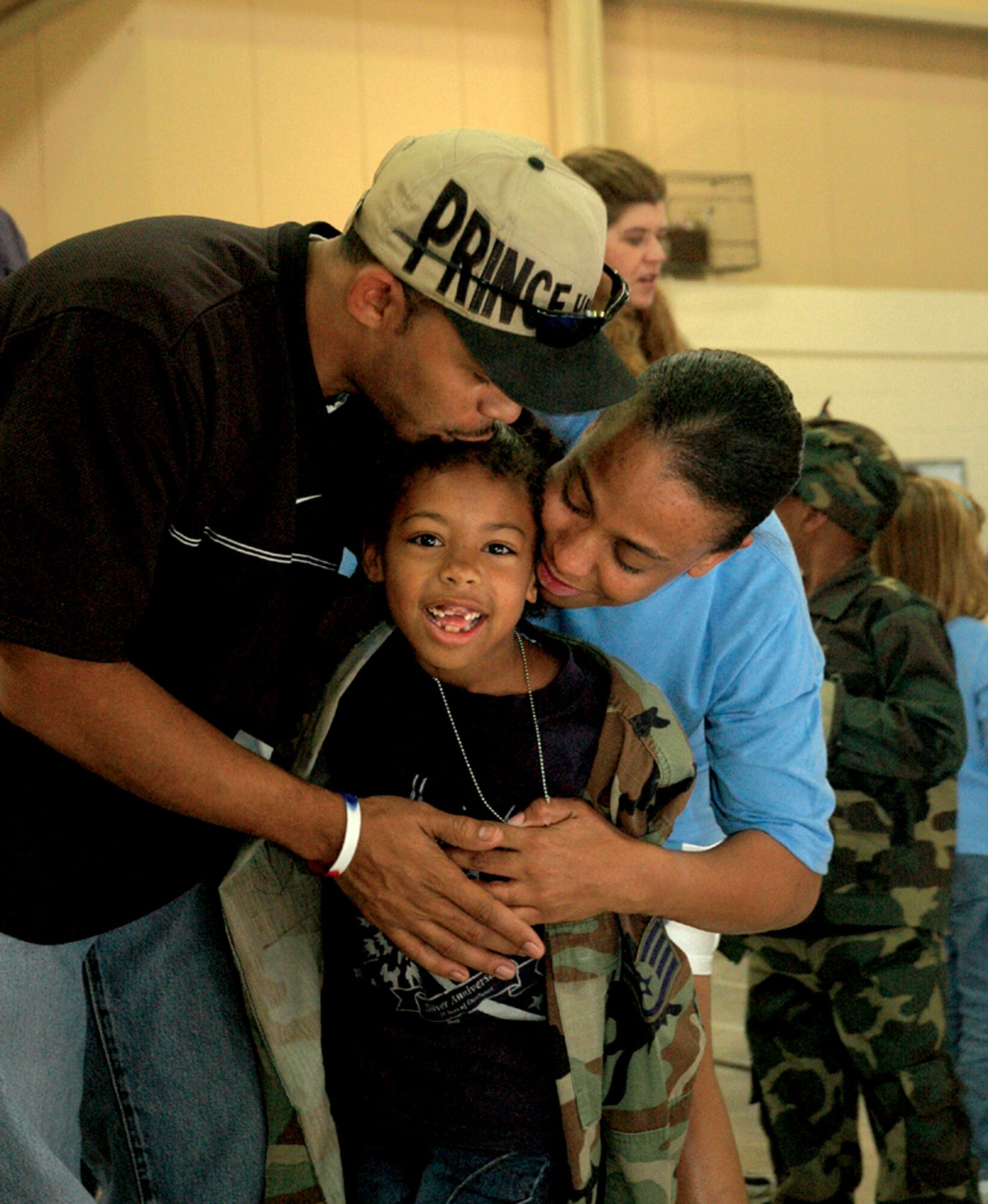 TYNDALL AIR FORCE BASE, Fla. (AFPN) -- Sienna Woods, 7, gets a big welcome-back hug from her parents, Angie and Staff Sgt. Frank Woods, of the 83rd Fighter Weapons Squadron. (U.S. Air Force photo by Chrissy Cuttita)
