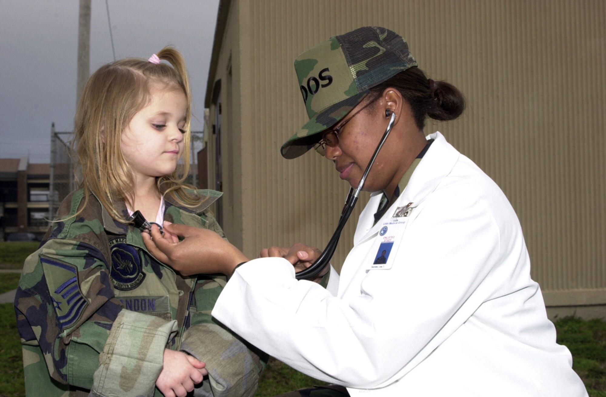 TYNDALL AIR FORCE BASE, Fla. (AFPN) -- McKenna Brandon is checked out by Staff Sgt. Lisa Gamble, an aerospace medical technician, at the physical exam stop of the deployment line. (U.S. Air Force photo by Master Sgt. Mary McHale)