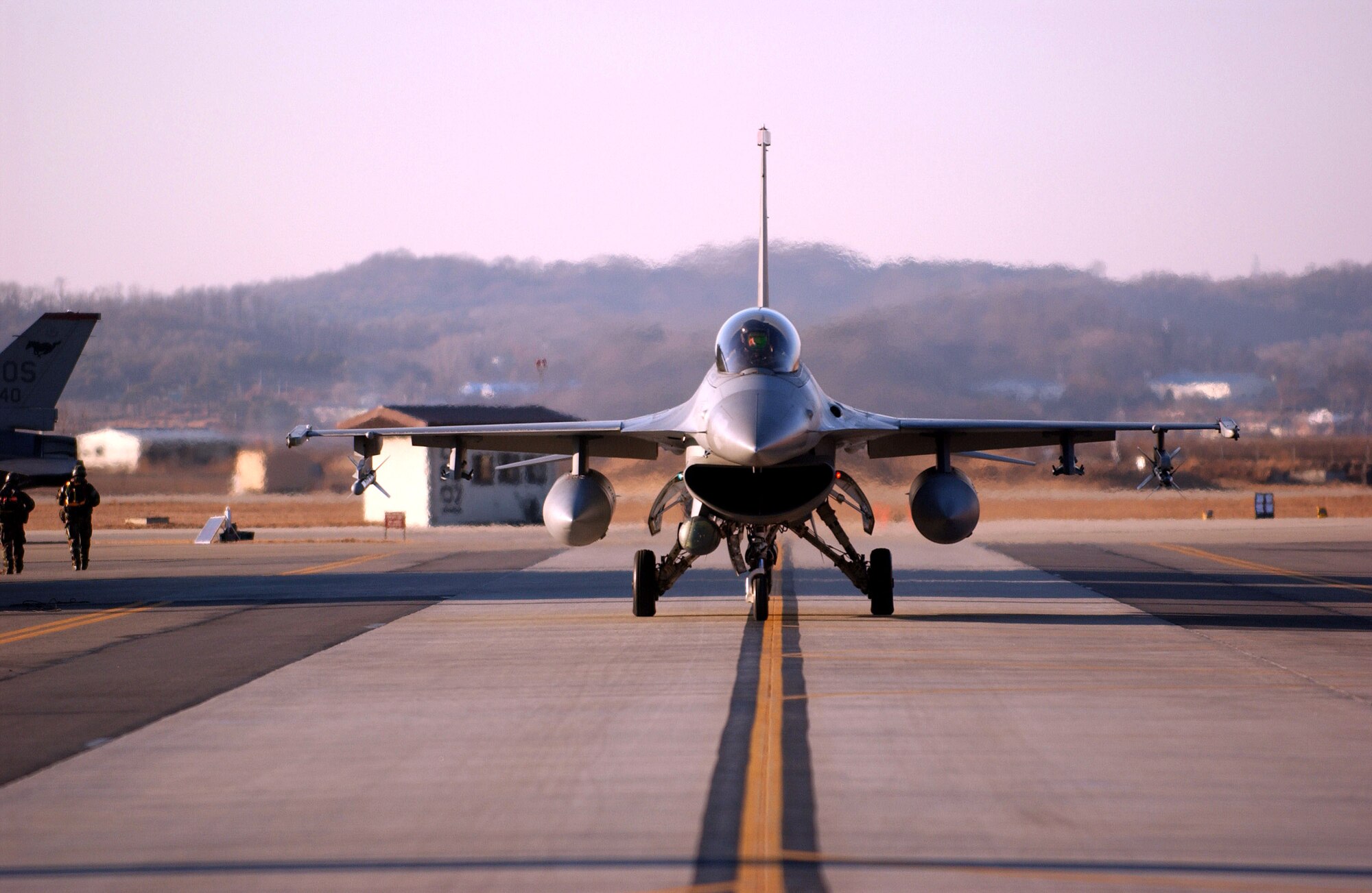 OSAN AIR BASE, South Korea (AFPN) -- An F-16 Fighting Falcon from the 36th Fighter Squadron returns from a mission during exercise Beverly Bulldog 06-01 here Jan. 24. Exercise scenarios test the base's ability to protect its operations from missile attacks or enemy forces. (U.S. Air Force photo by Airman Gina Chiaverotti)

