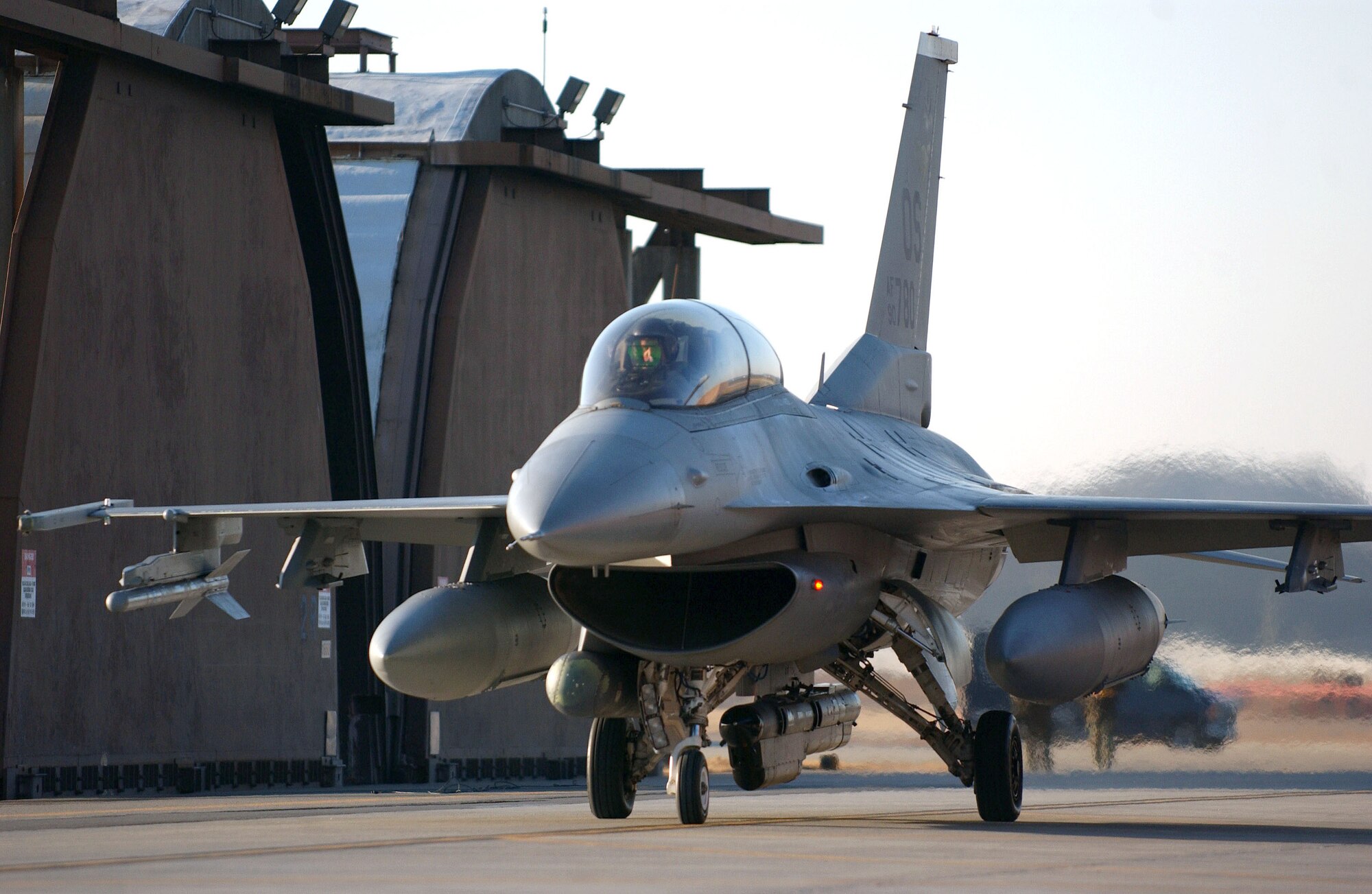 OSAN AIR BASE, South Korea (AFPN) -- An F-16 Fighting Falcon returns after flying a training mission supporting exercise Beverly Bulldog 06-01 here Jan. 24. Exercise scenarios test the base's ability to protect its operations from missile attacks or enemy forces. (U.S. Air Force photo by Tech. Sgt. Jeffrey Allen)

