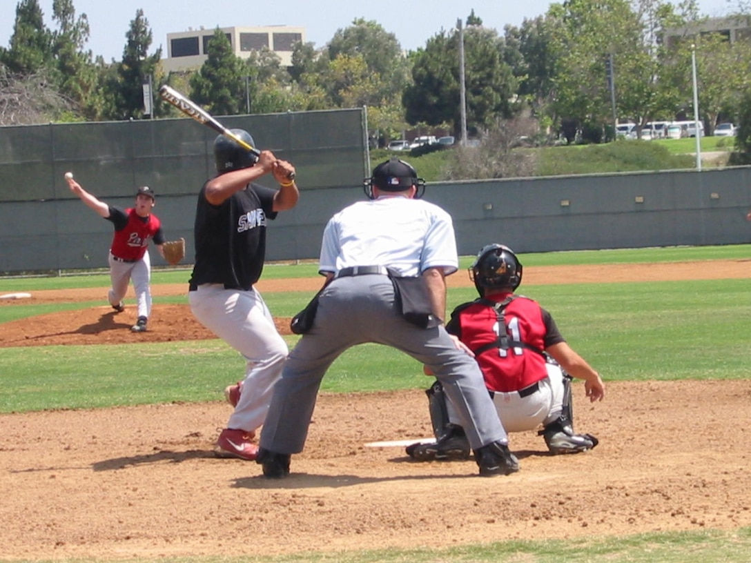 Gunnery Sgt. Marco A. Rico umpires a college baseball game at the University of California, San Diego.