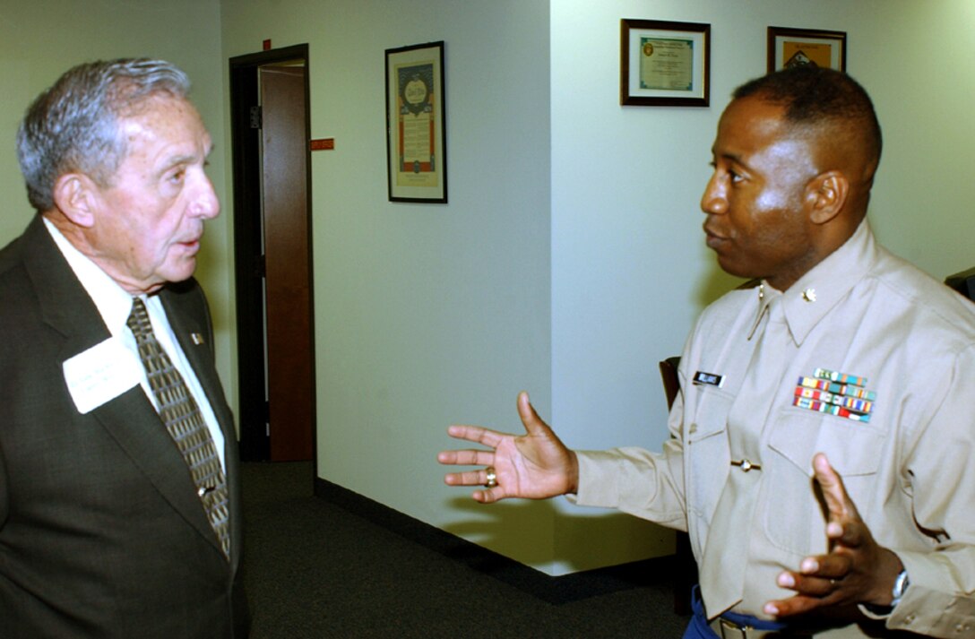 FORT WORTH, Texas- Retired Marine Lt. Gen. Richard E. Carey listens as Maj. Delaney C. Williams, 8th Marine Corps District Logistics Officer talks about the new headquarters building.  Carey, who retired in 1983 as the Commanding General, Marine Corps Development and Education Command, Quantico, Va., was among many distinguished guests on hand to celebrate the re-establishment of the 8th Marine Corps District from its longtime home in New Orleans, La., to Texas.  (USMC photo by Sgt. Virgil P. Richardson).