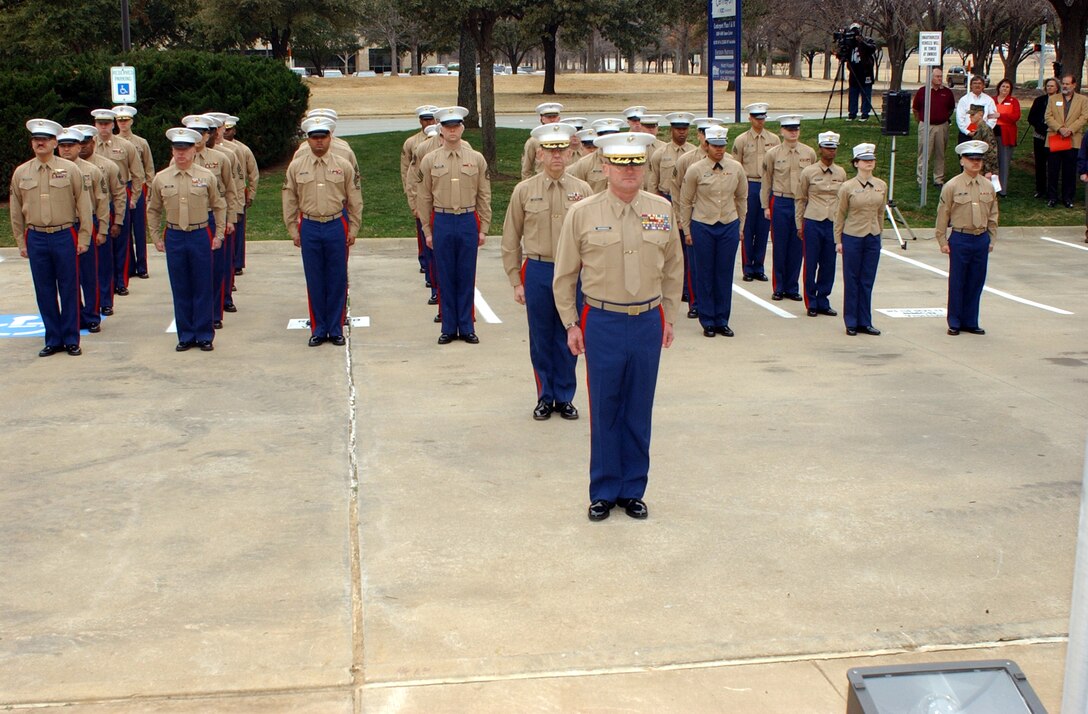 FORT WORTH, Texas- Members of the 8th Marine Corps District, led by Col. Carl F. Huenefeld (foreground) observe the Marines Hymn during a re-establishment ceremony held recently.  Displaced from New Orleans by mulitiple hurricanes last year, the district has established a permanent home in Texas.  (USMC photo by Sgt. Virgil P. Richardson).