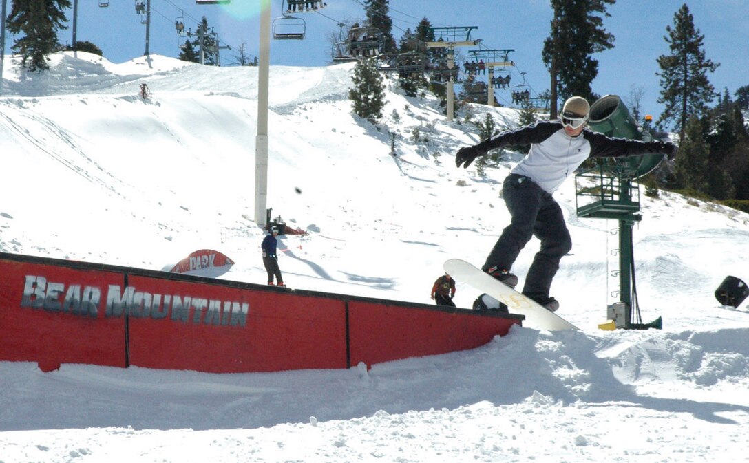 Cpl. John Hardin, Marine Aviation Logistics Squadron 13 aviation technician, hops onto a box in the freestyle park of Bear Mountain Jan 28.