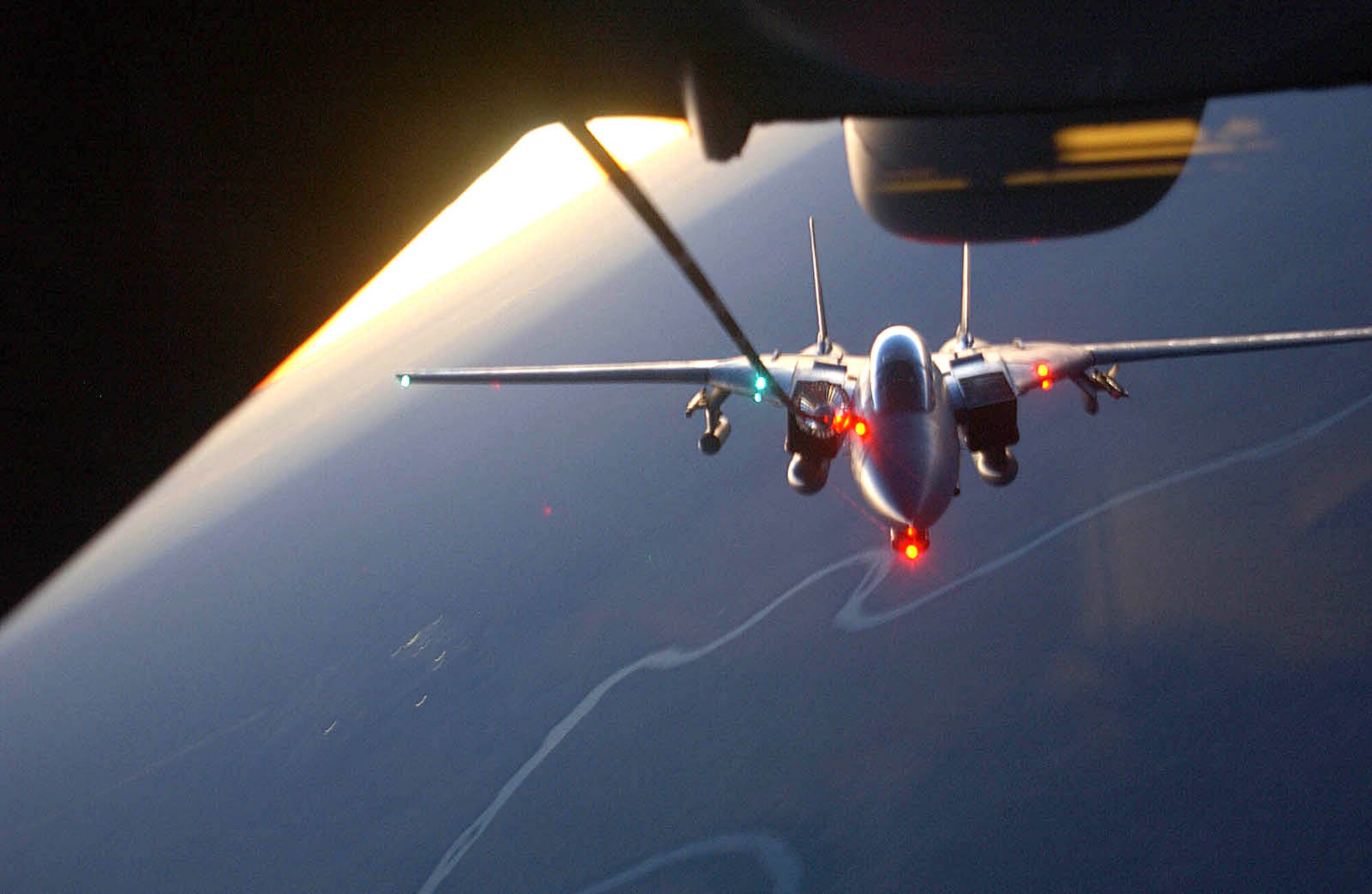 SOUTHWEST ASIA (AFPN) -- A Navy F-14 Tomcat refuels over Iraq at sunset from a KC-10 Extender aircraft assigned to the 908th Expeditionary Refueling Squadron. The F-14 is supporting Operation Iraqi Freedom. (U.S. Air Force photo by Tech. Sgt. Mike Hammonds)