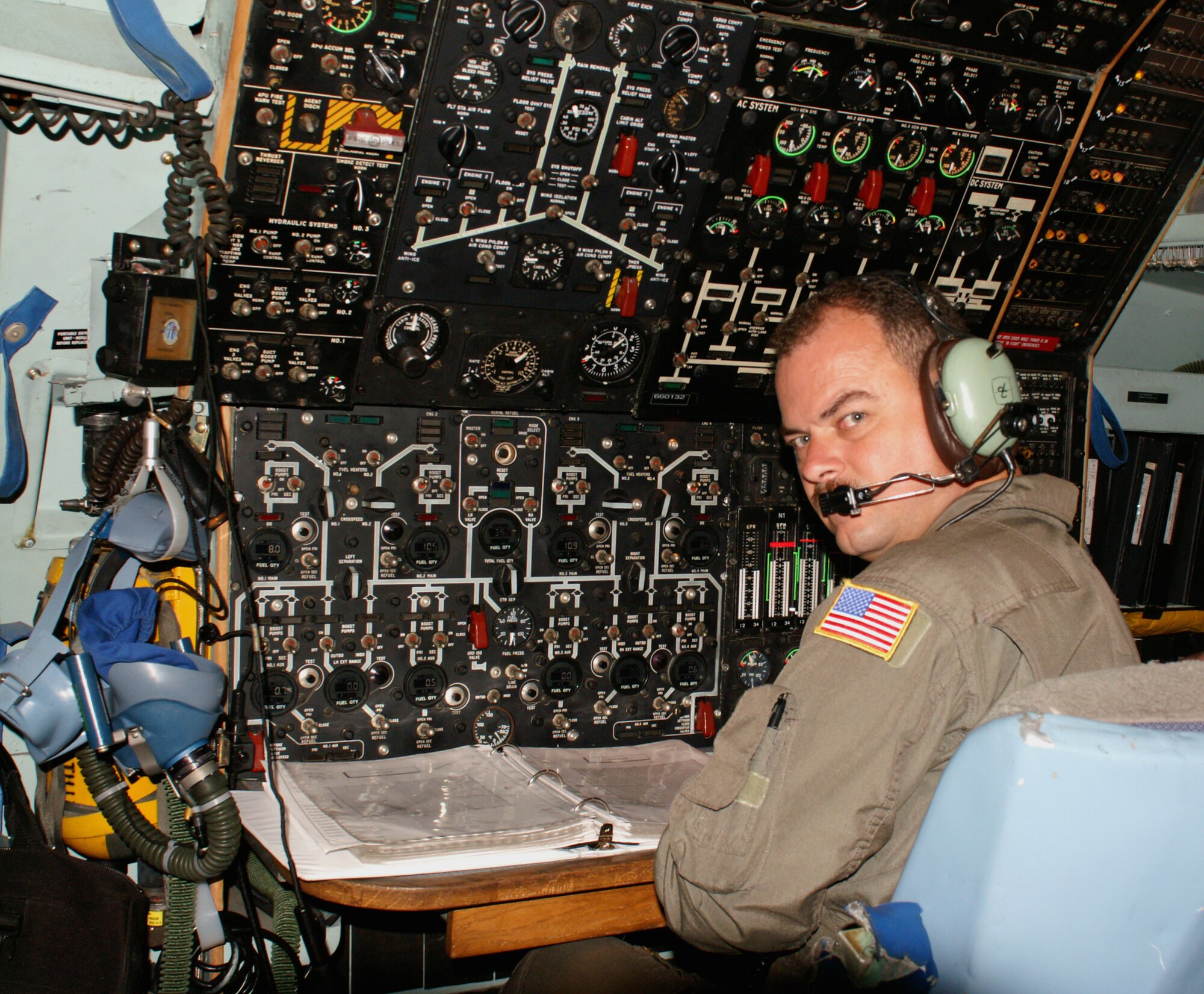 Tech. Sgt. Monty Monteau, a C-141 flight engineer from the 445th Airlift Wing, begins his landing check list before the aircraft lands in Balad AB, Iraq for the last time. (U.S. Photo by Lt. Col. Matt Meintel)